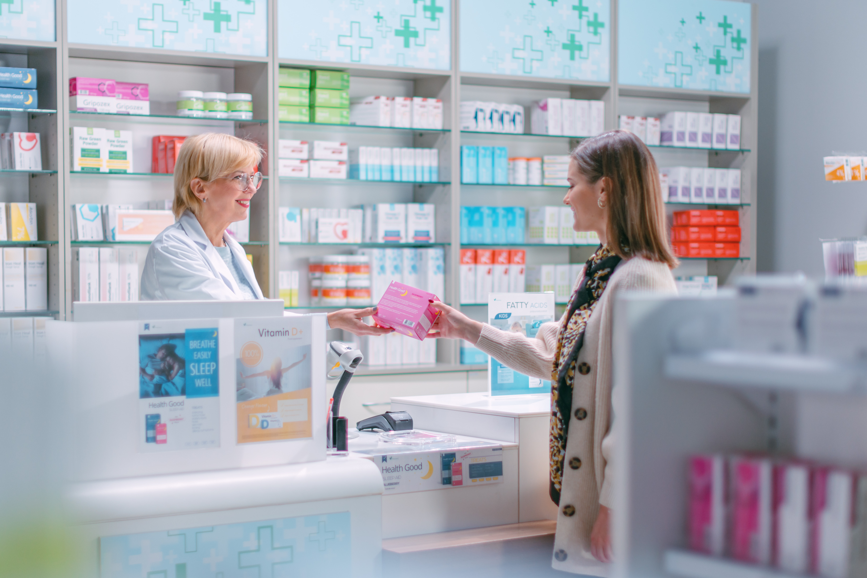 A pharmacist helping a customer in a pharmacy