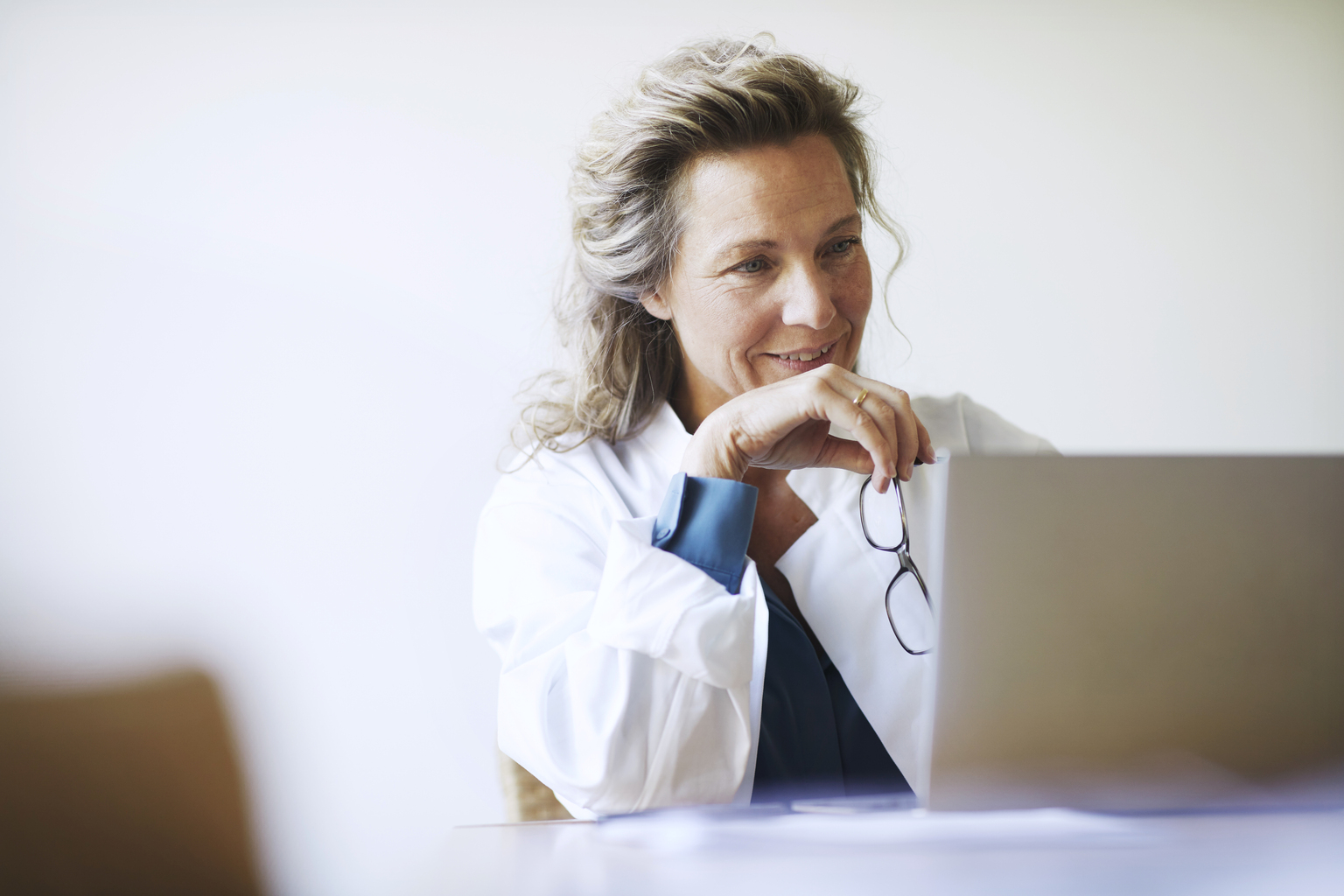 Female doctor using laptop