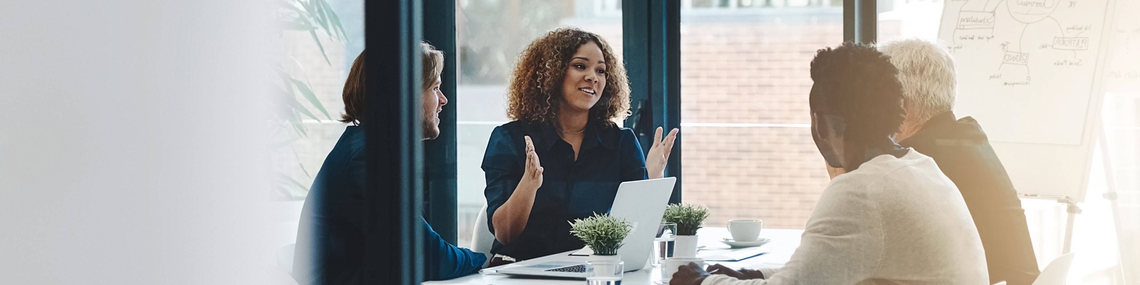 Cropped shot of a group of businesspeople having a boardroom meeting in an office