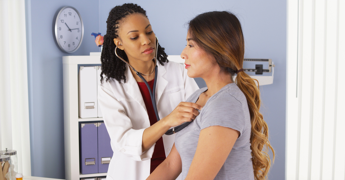 Healthcare worker providing physical assessment exam