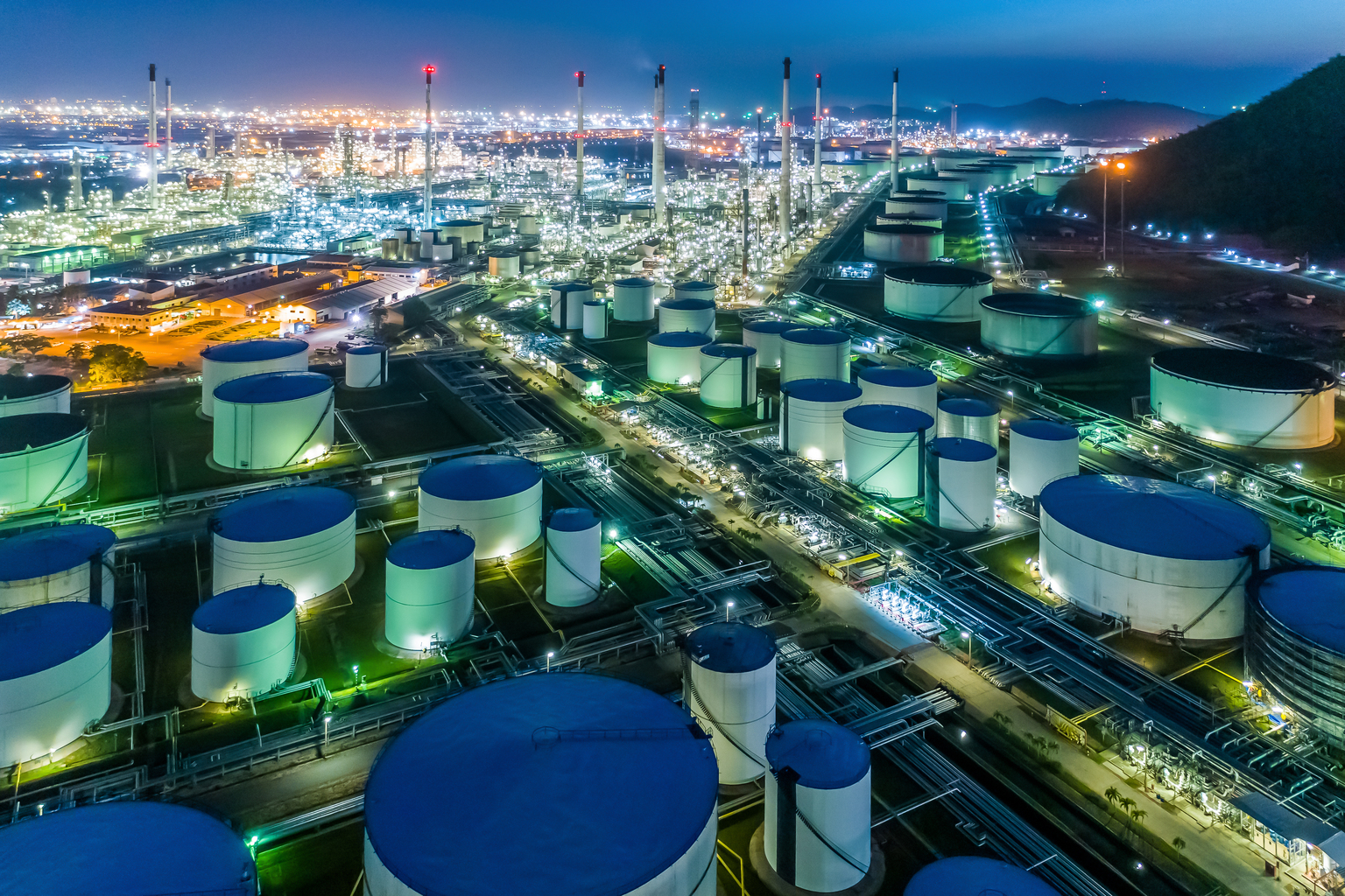 Aerial top view Oil refinery factory at night for energy or gas industry background