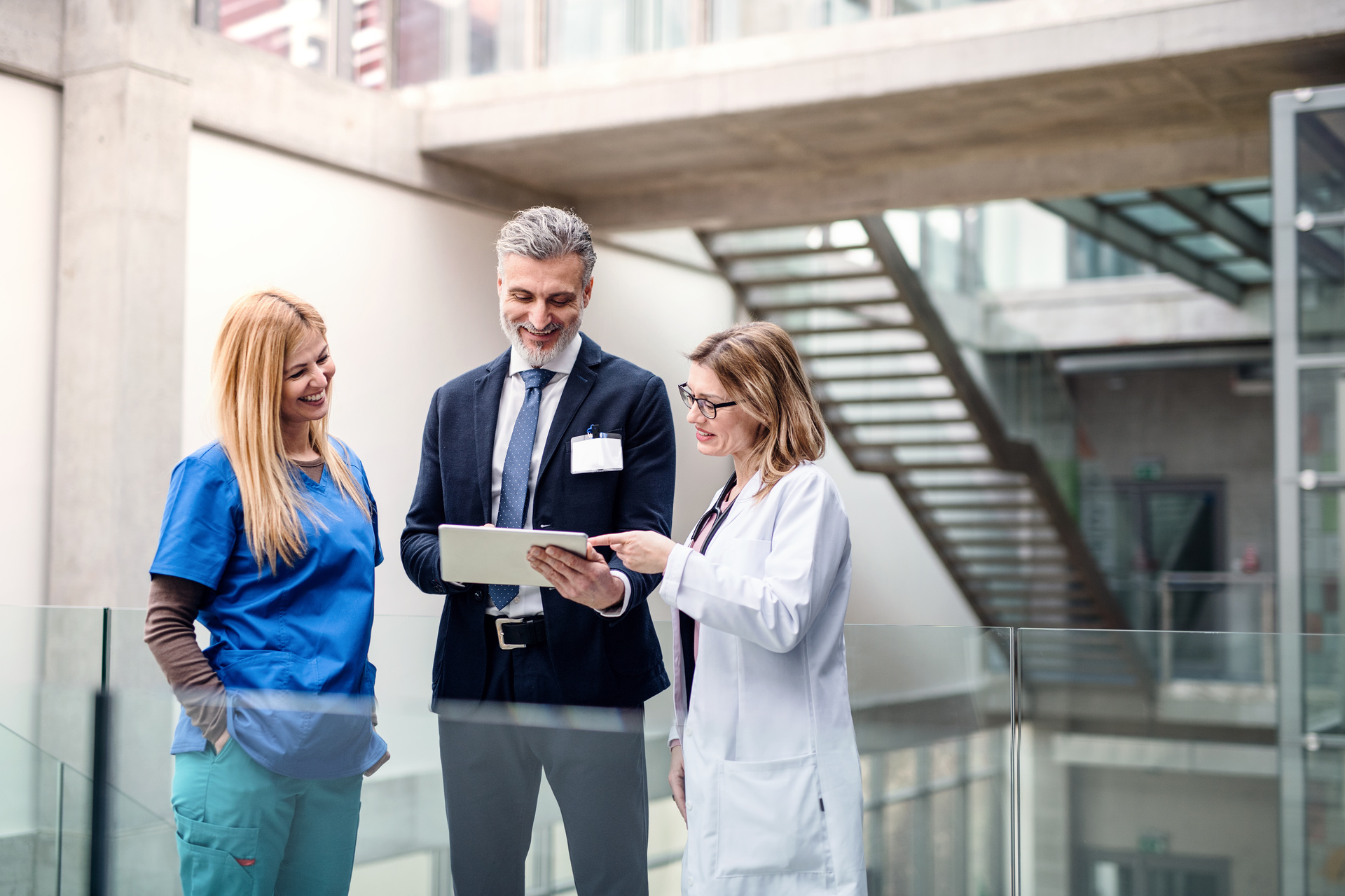 Two doctors talking to hospital administrator