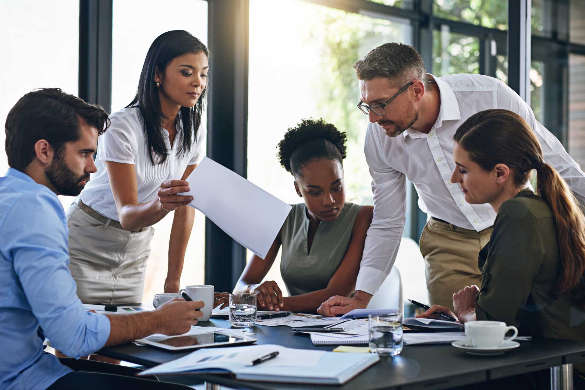 Group reviews documents on table