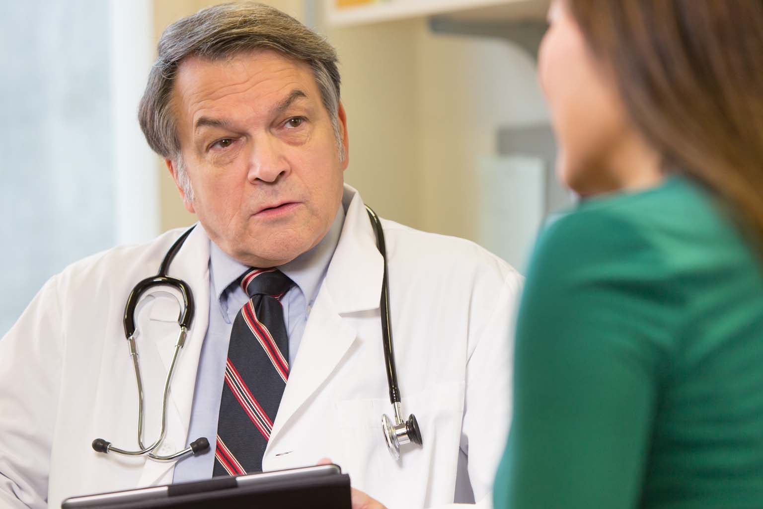 doctor and patient seated in office