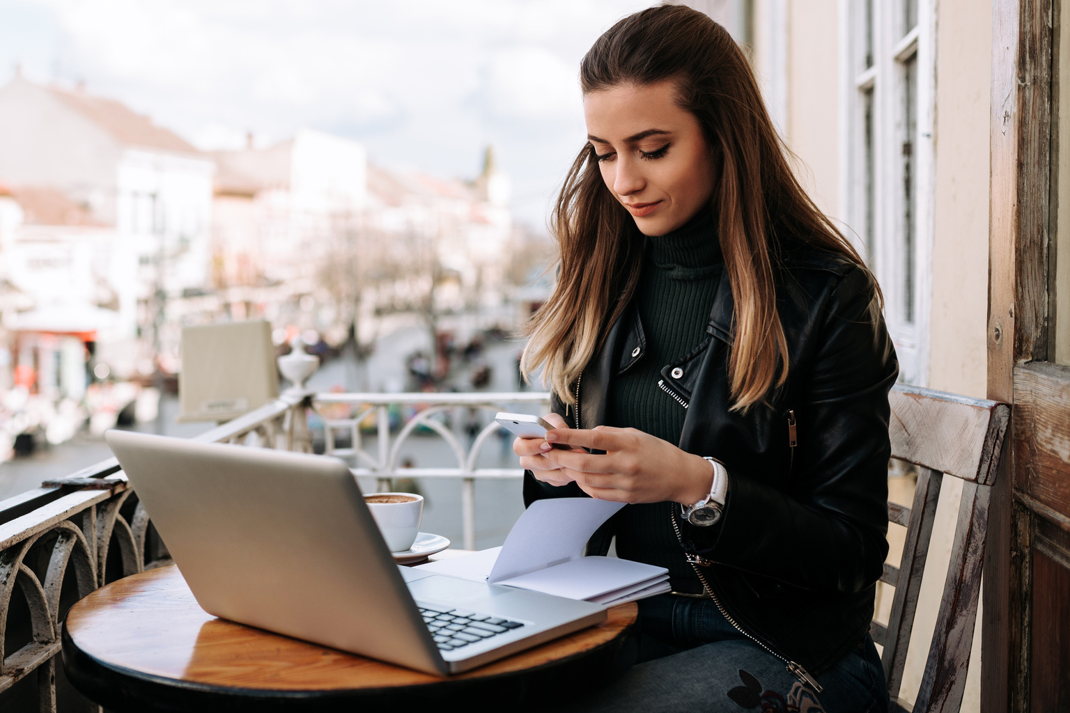 young woman laptop cafe