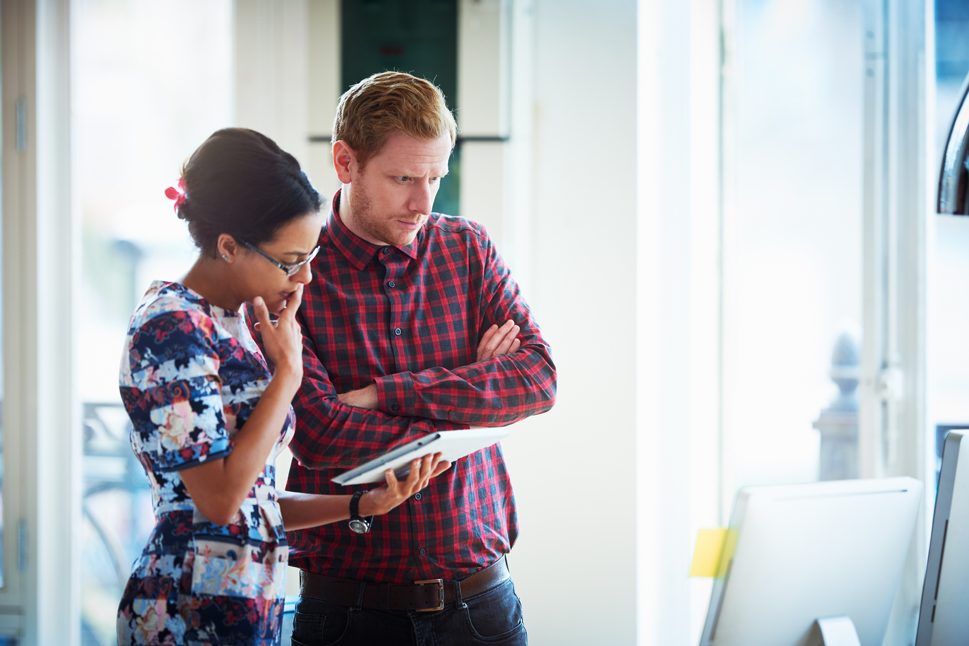 Business people contemplating and working together in the office.