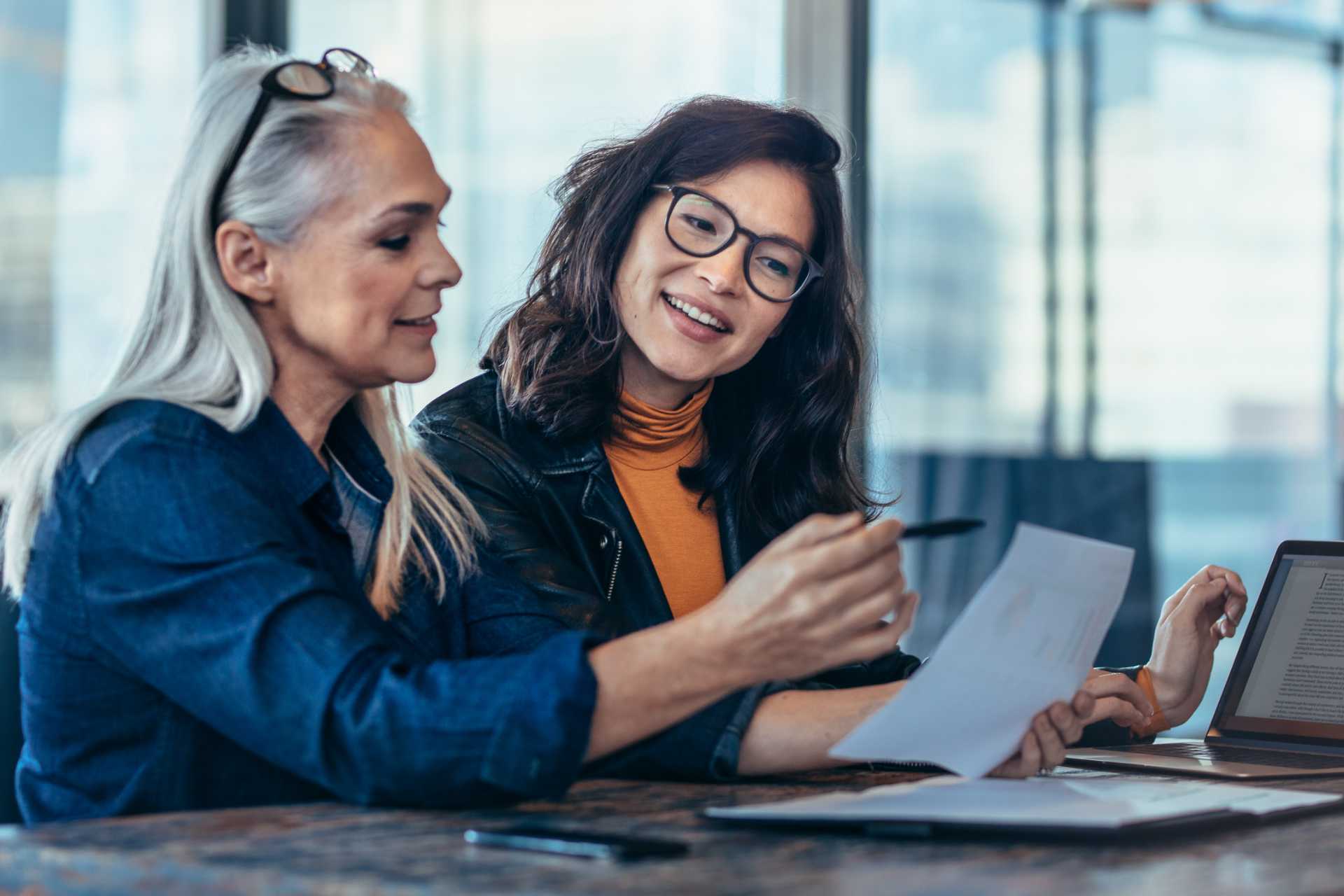 Mature and young woman consult