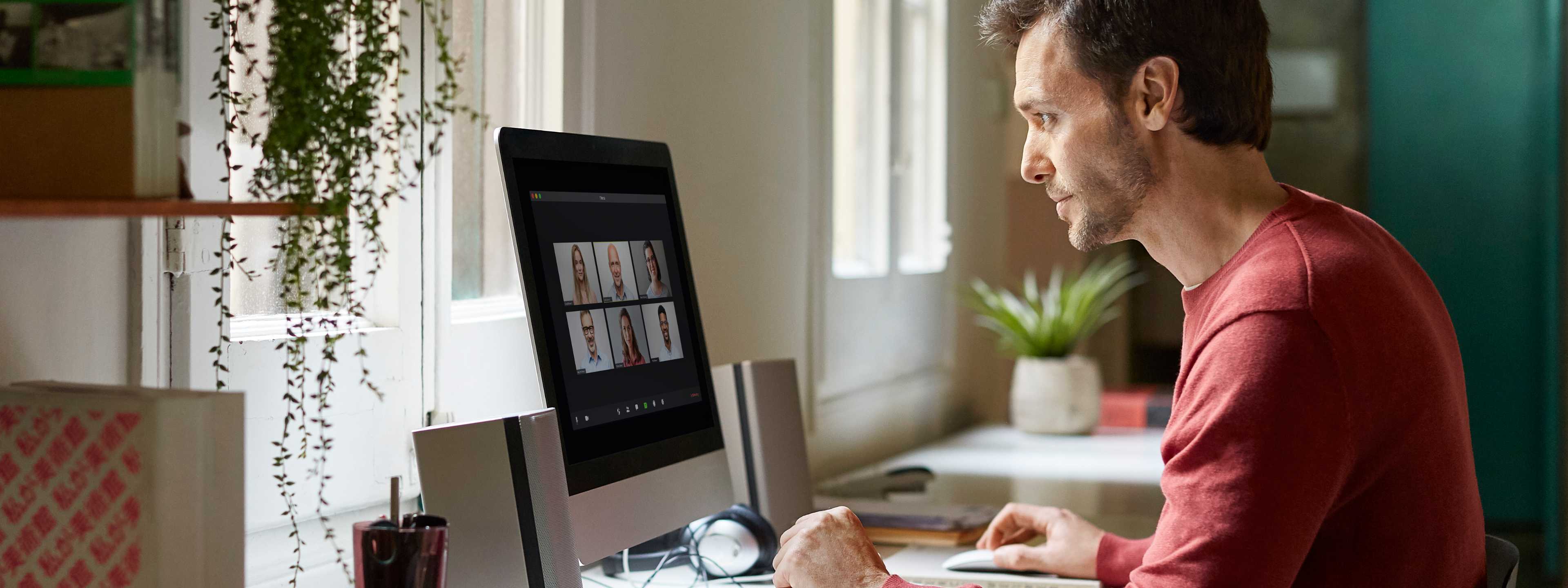 Man working from home on desktop computer