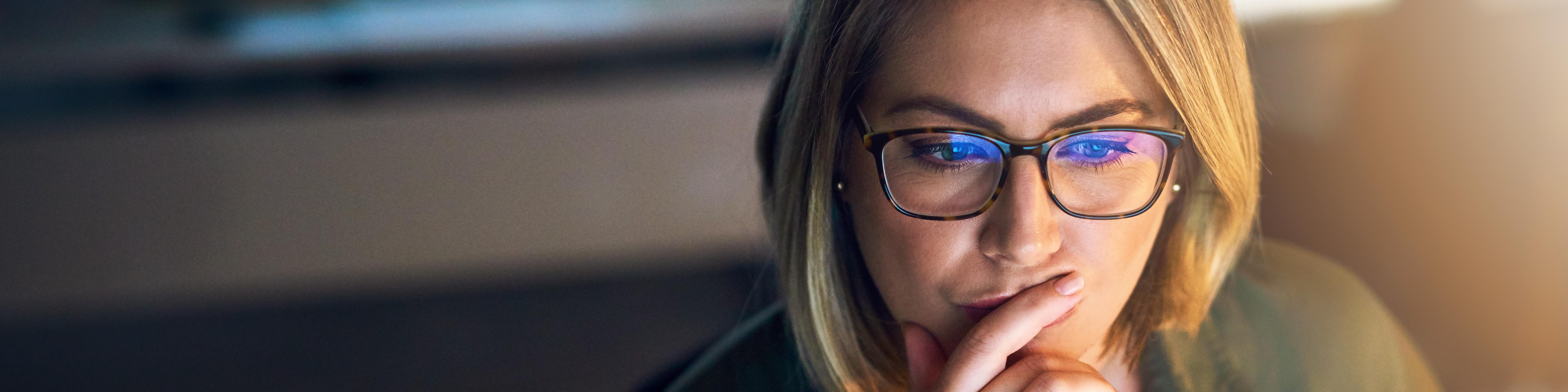 Woman with Laptop Reading and Thinking