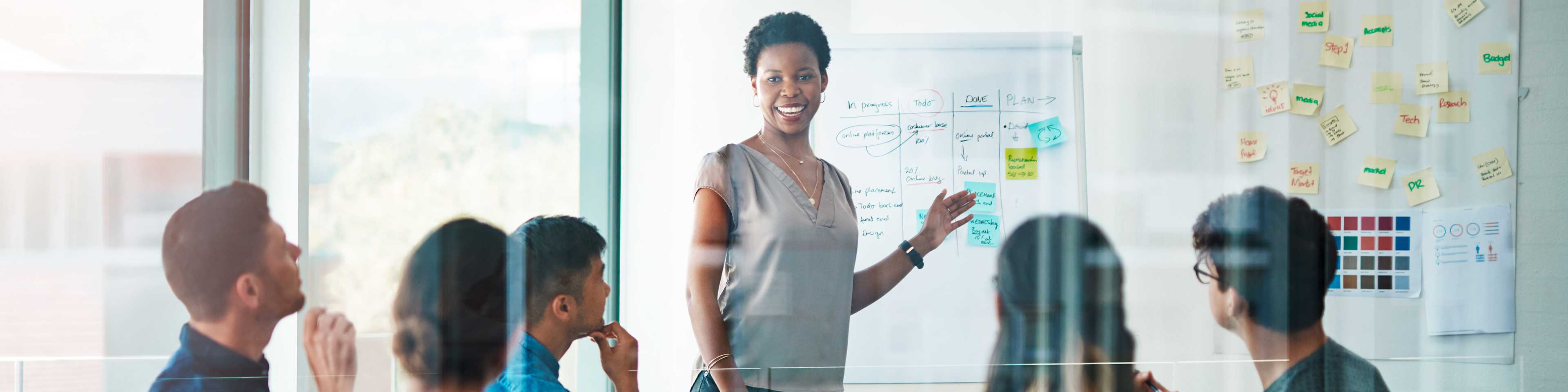 Woman leads group at flipchart