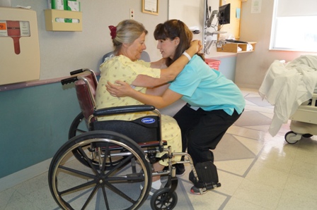 nurse assisting patient