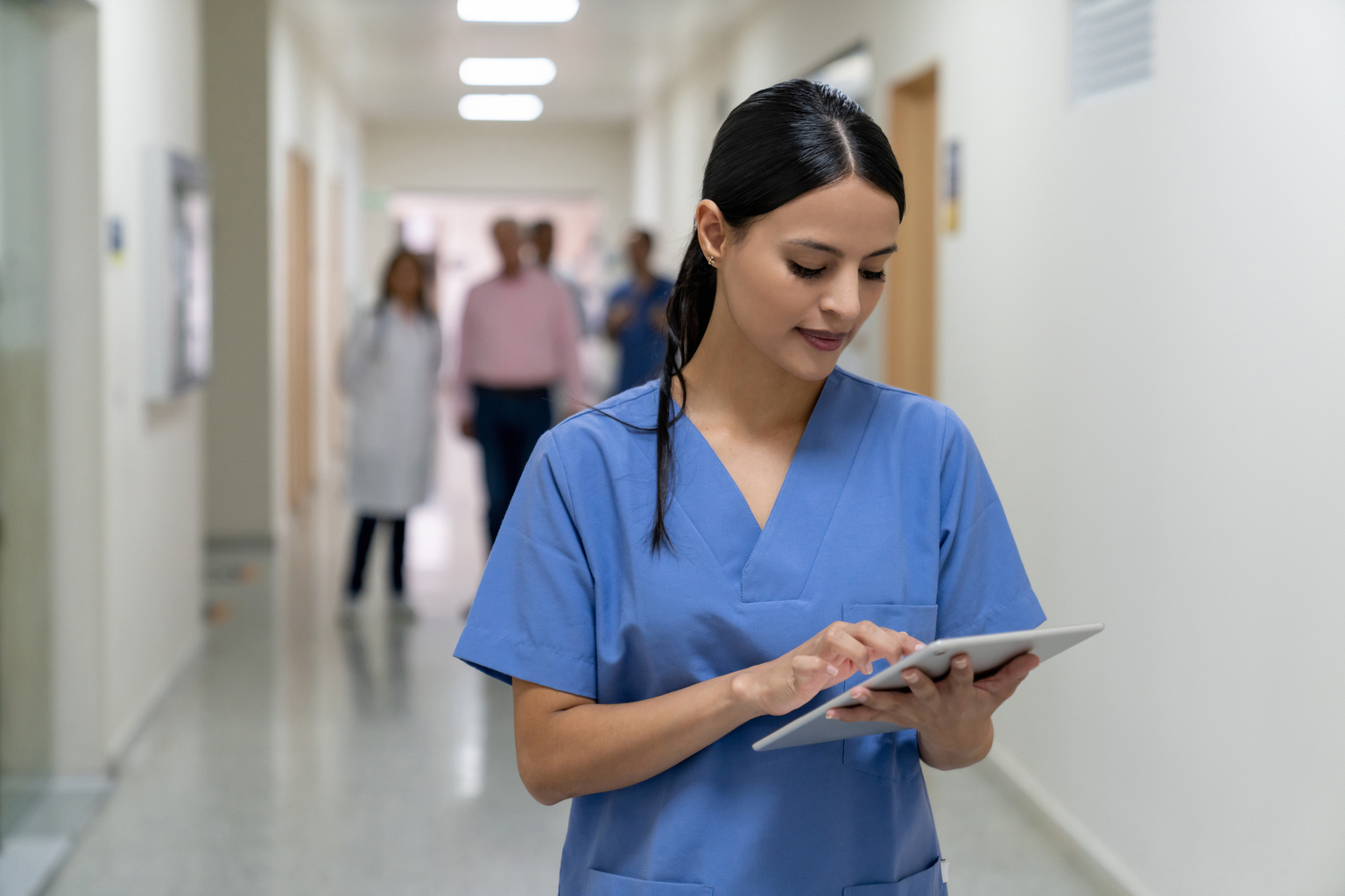 Female nurse using tablet at the hospital