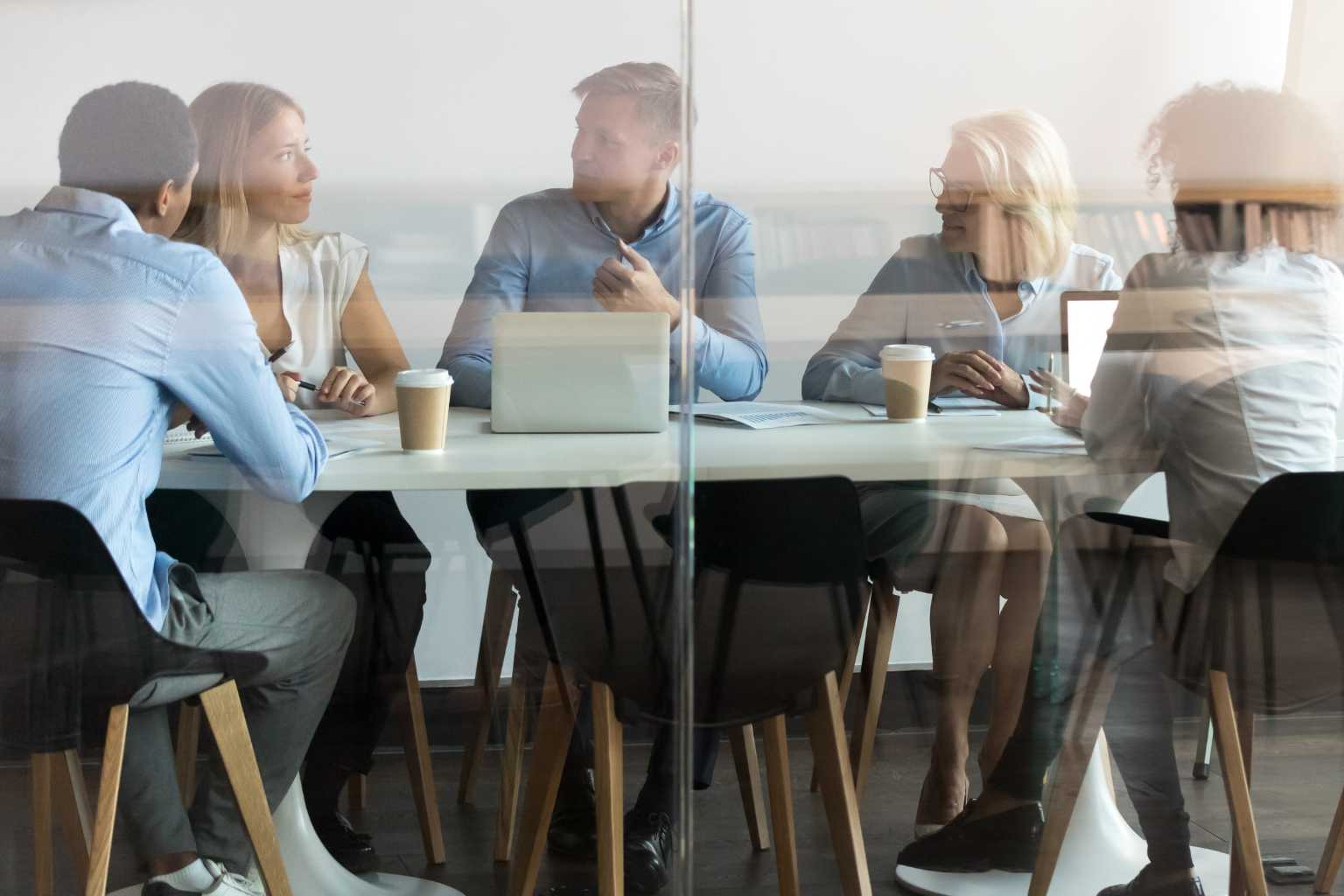 Group meets at conference table