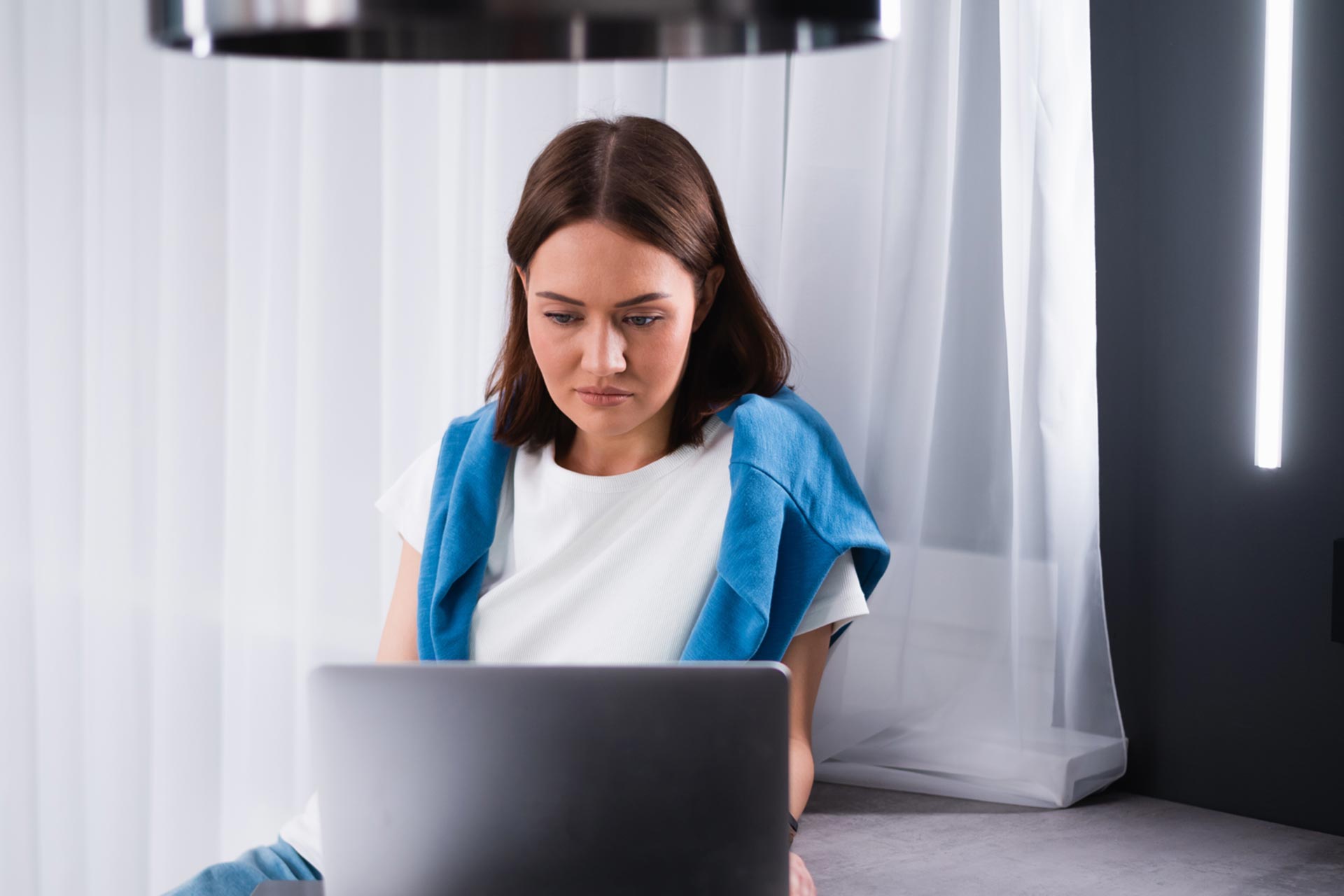 Woman updating her business name on her laptop