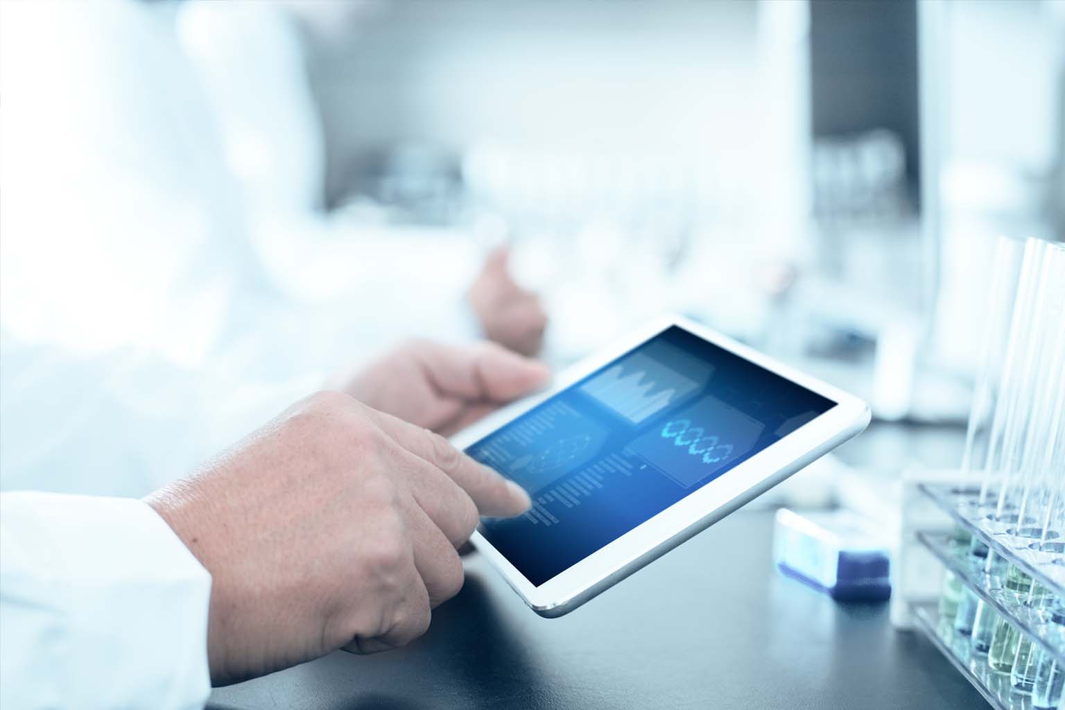 pharmacist in lab using tablet