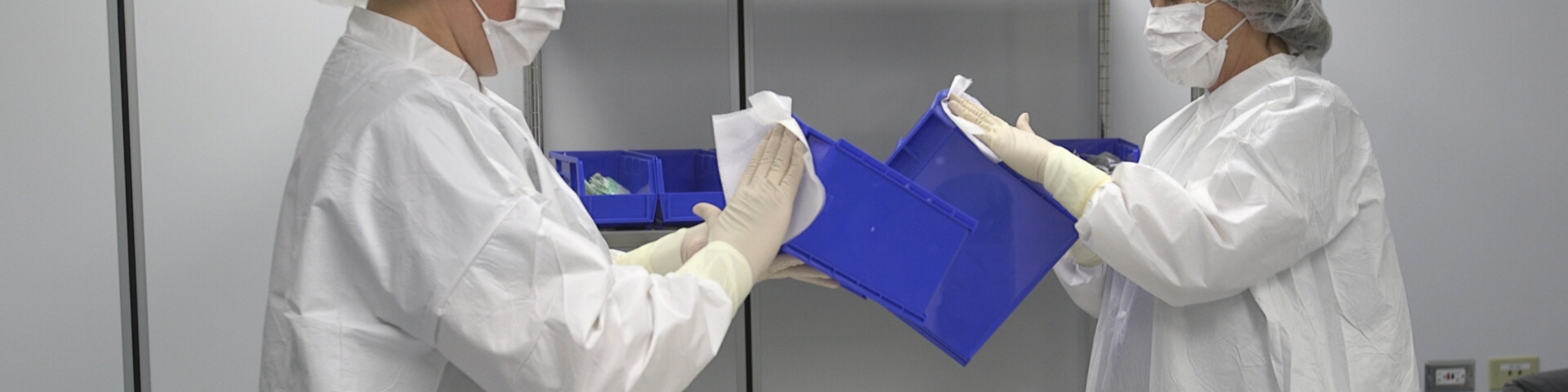 Pharmacist cleaning the sterile compounding bins