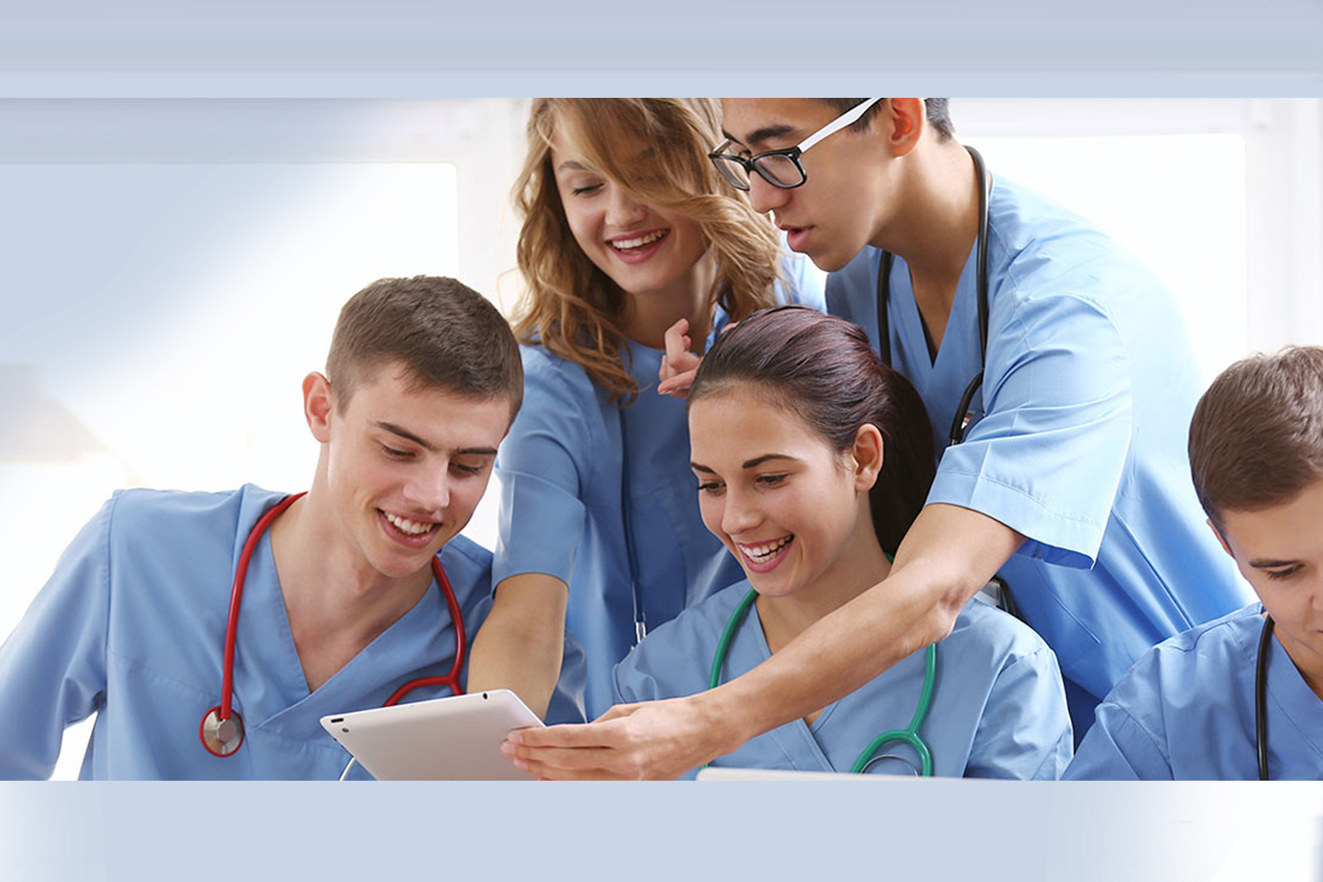 Group of nursing students looking at tablet