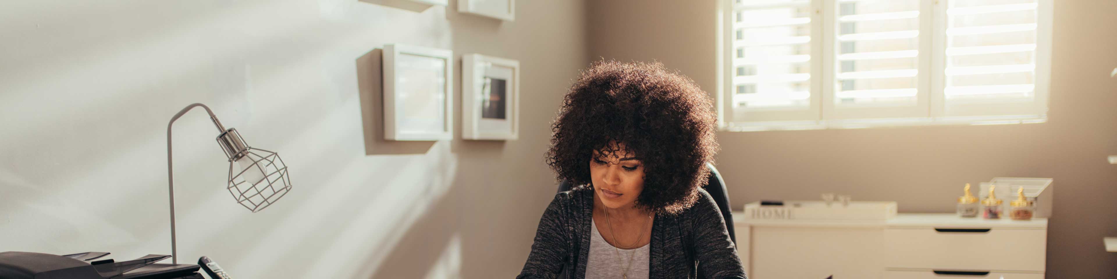 a businesswoman working from her home office