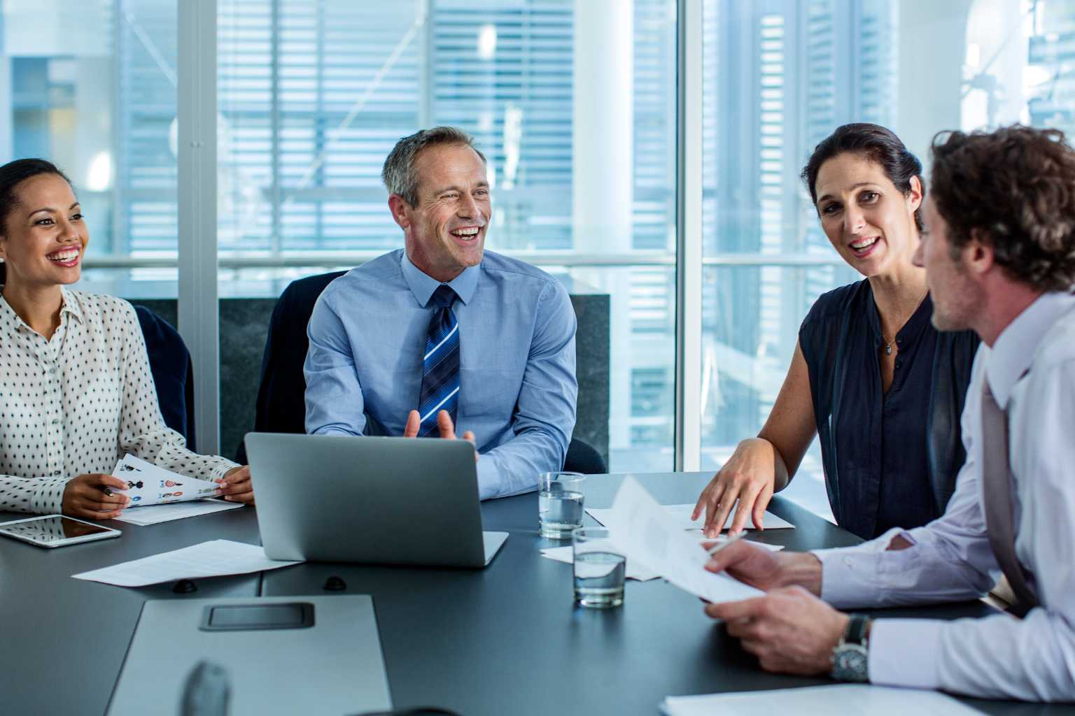 Group of professionals meet at office table