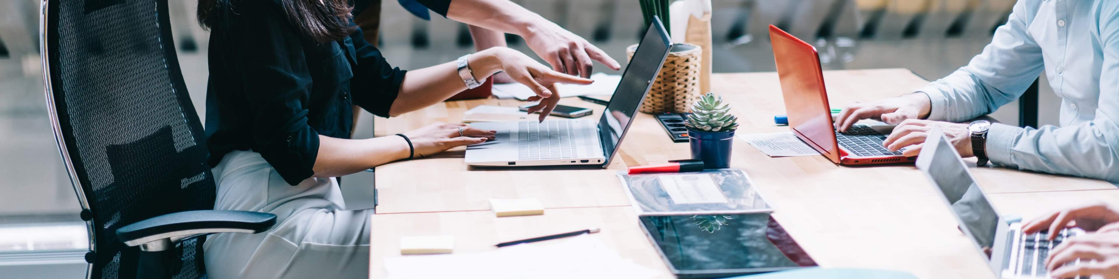 Proud-CEO-pointing-on-laptop-computer