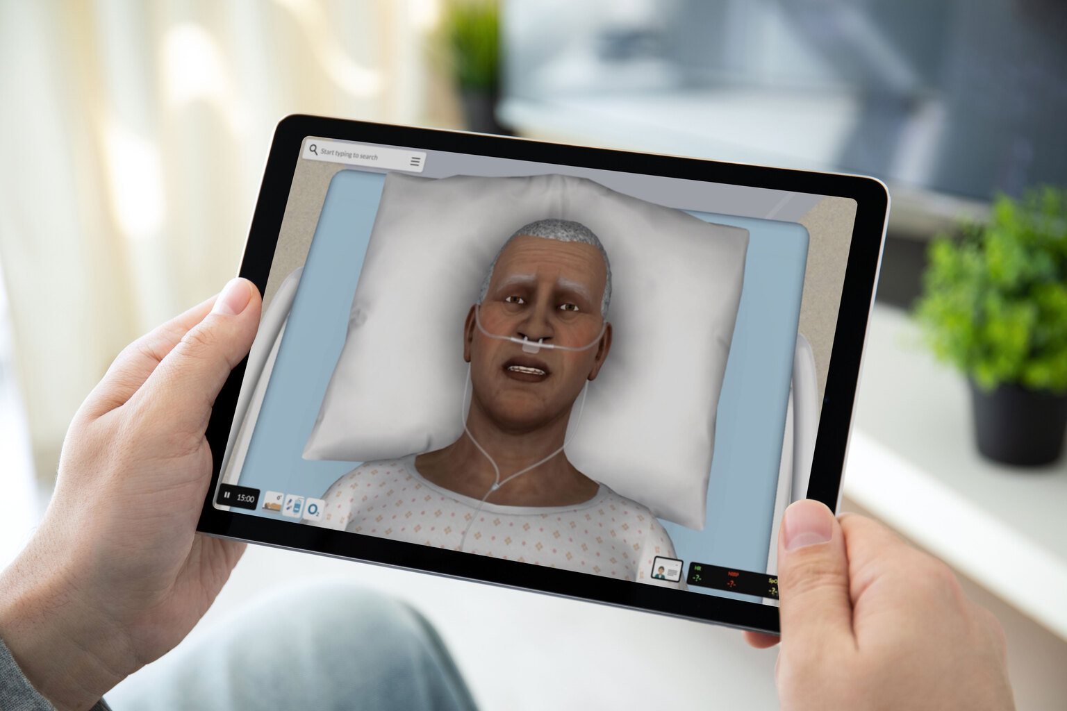 Close up on person holding a tablet and watching something from the vSim for Nursing app