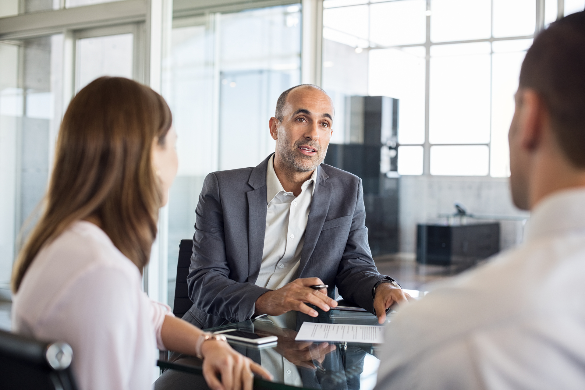 Financial advisor with clients 