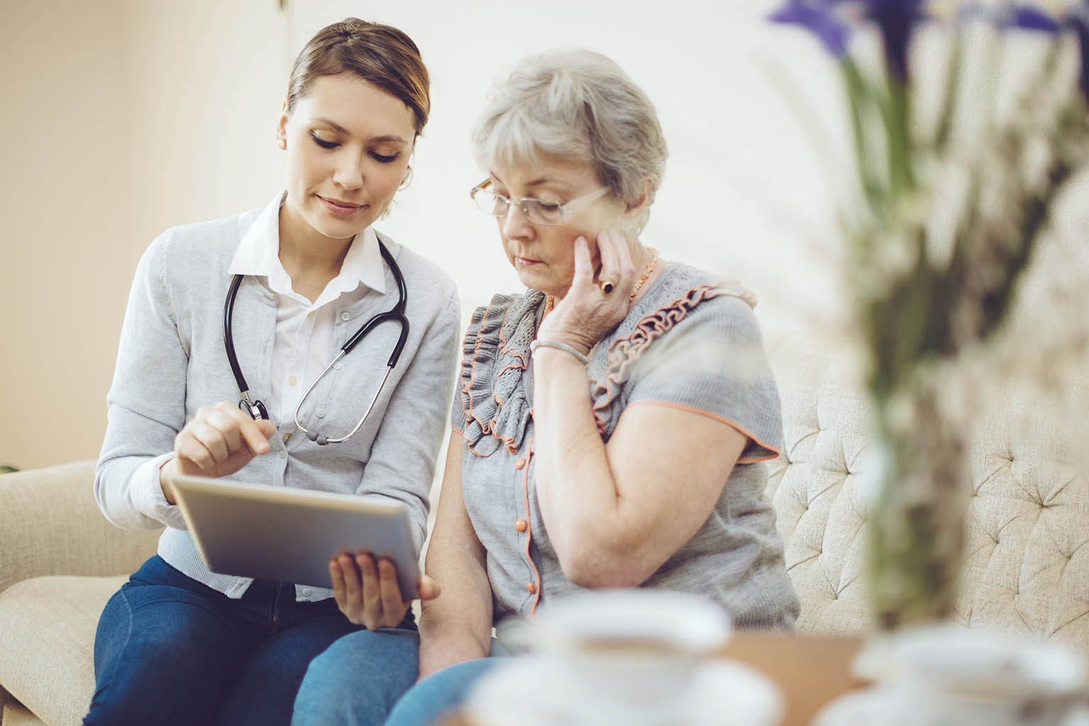 clinician with elderly female patient