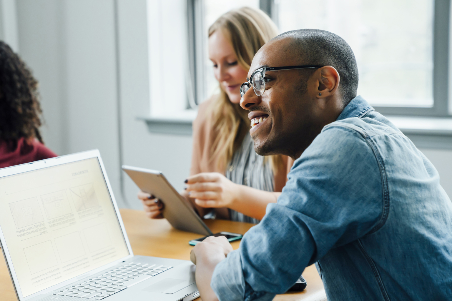 Business people using technology in meeting. Digital Life. OneWebGetty2021