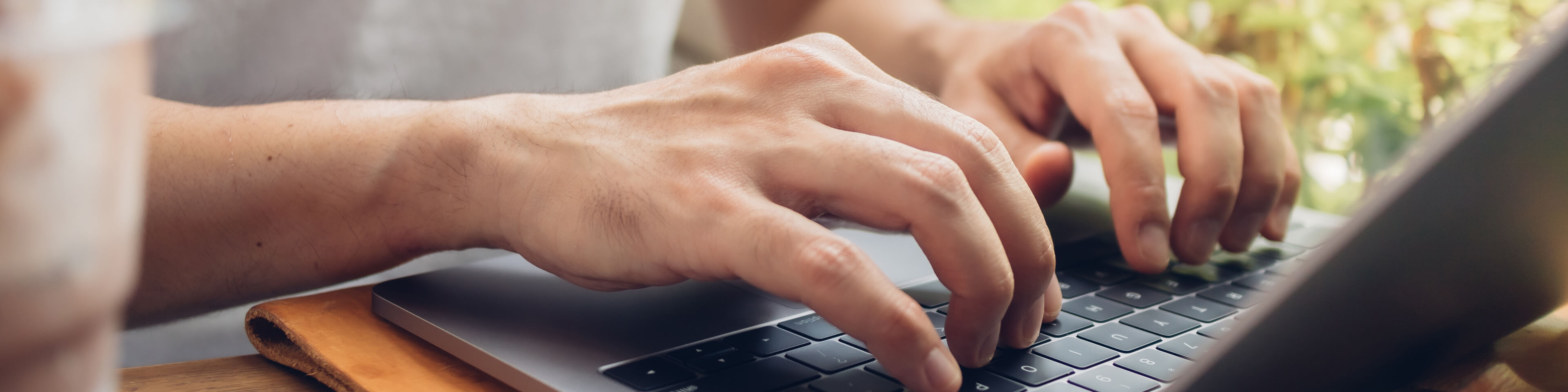 Person typing on computer keyboard