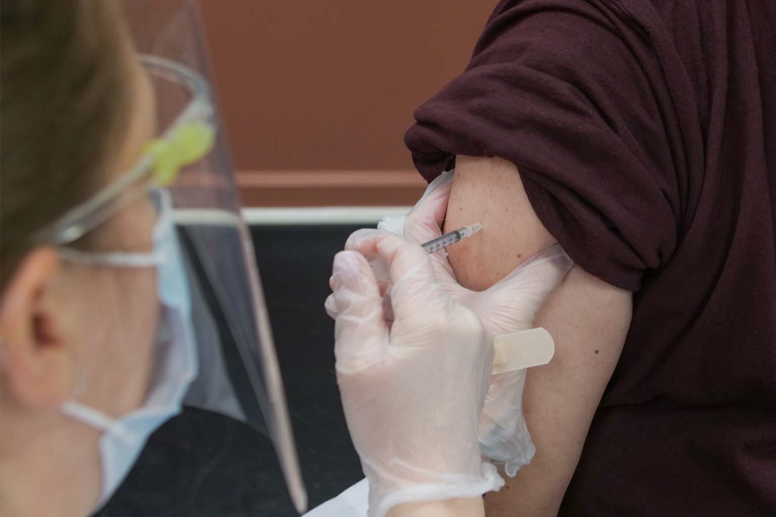 closeup of individual receiving vaccination
