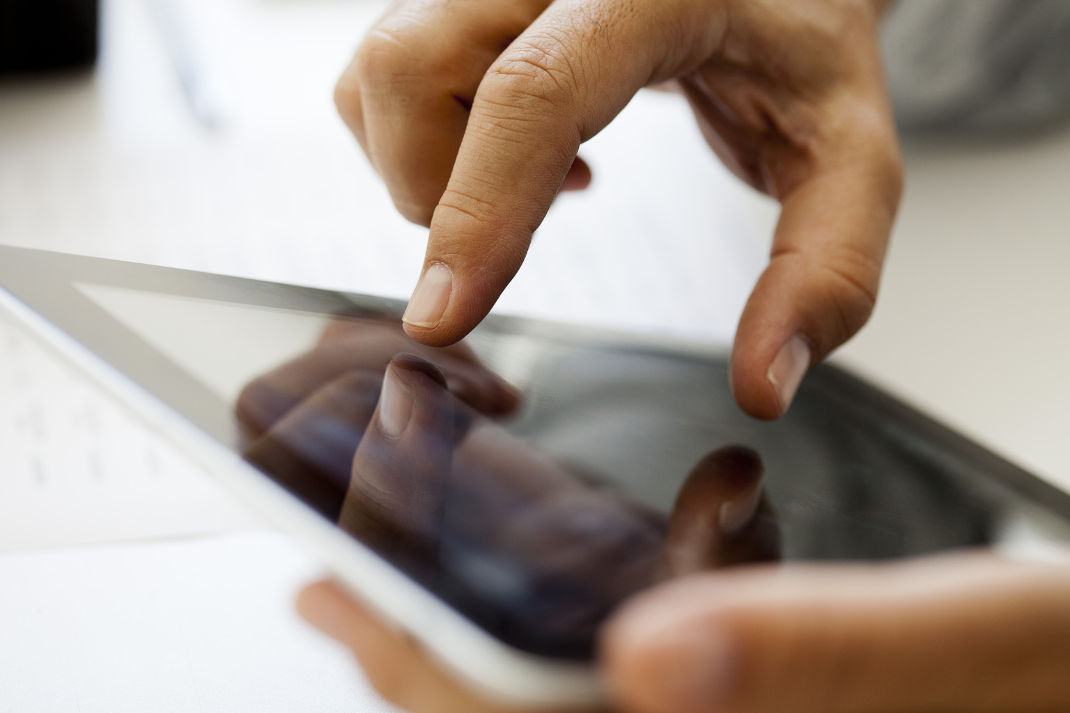 Up close photography shot, image of man zooming in on his ipad, Q3 2021, TAA NA US - Preparer