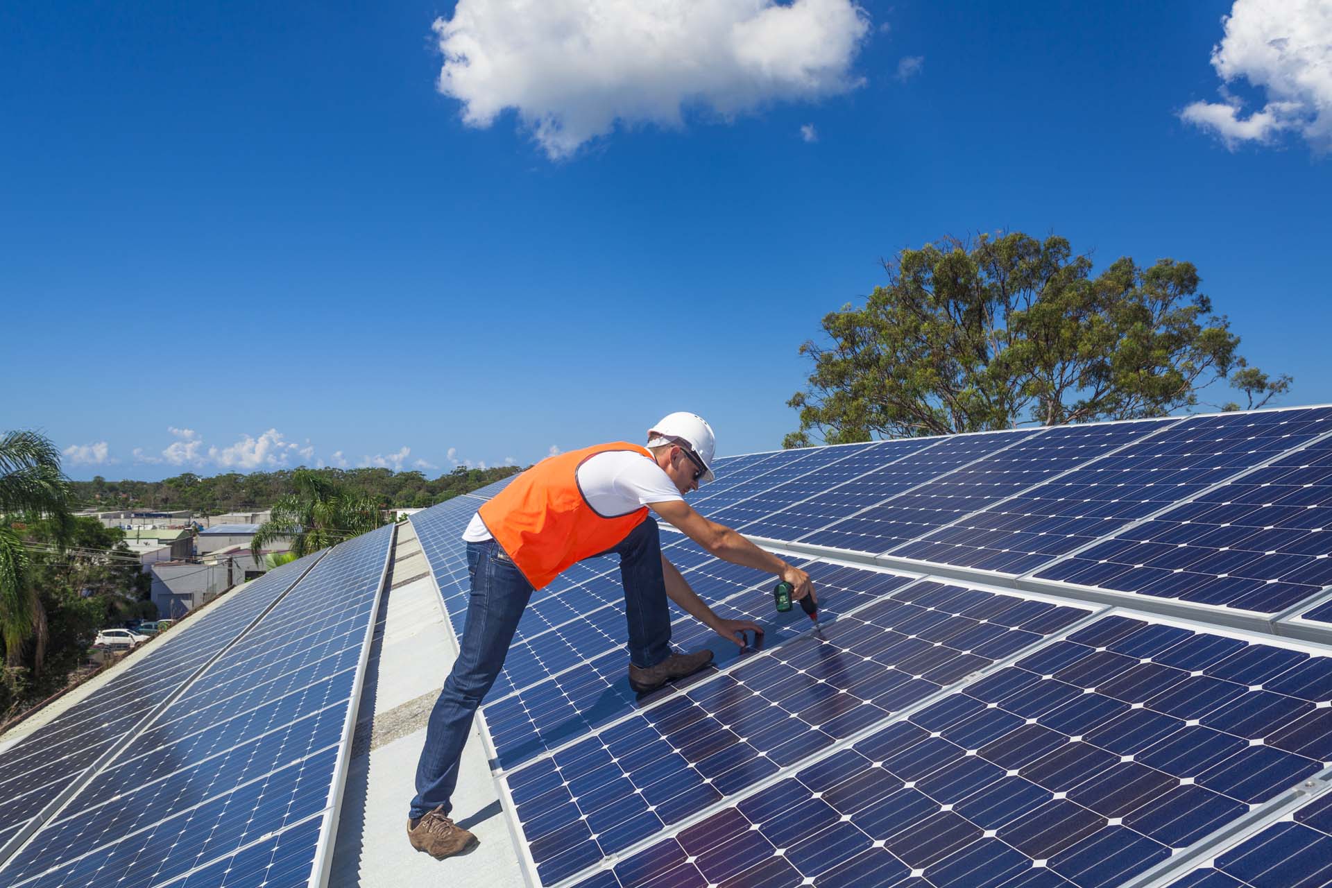 man working on a solar panel.