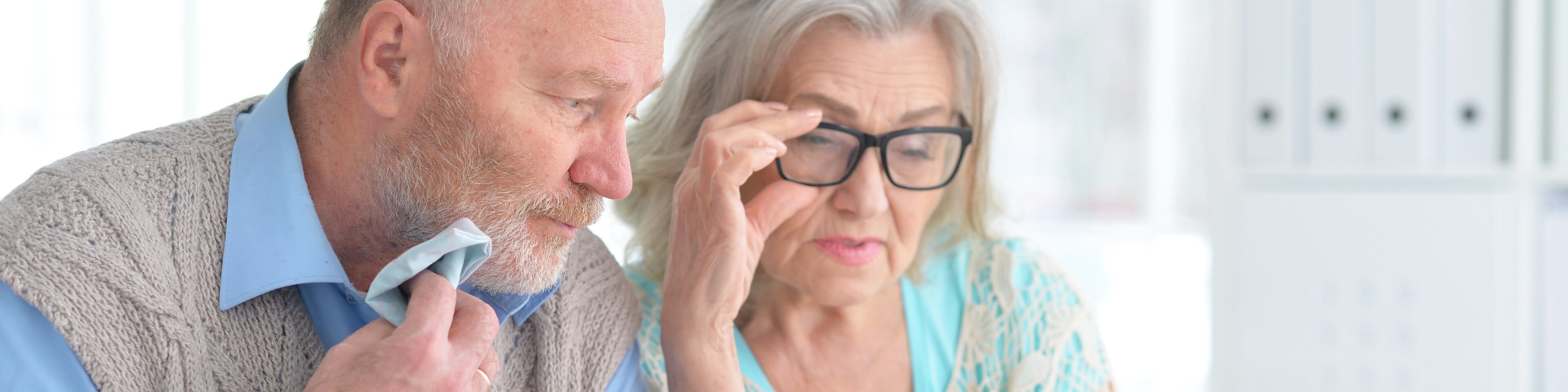 Senior couple reading prescription labels