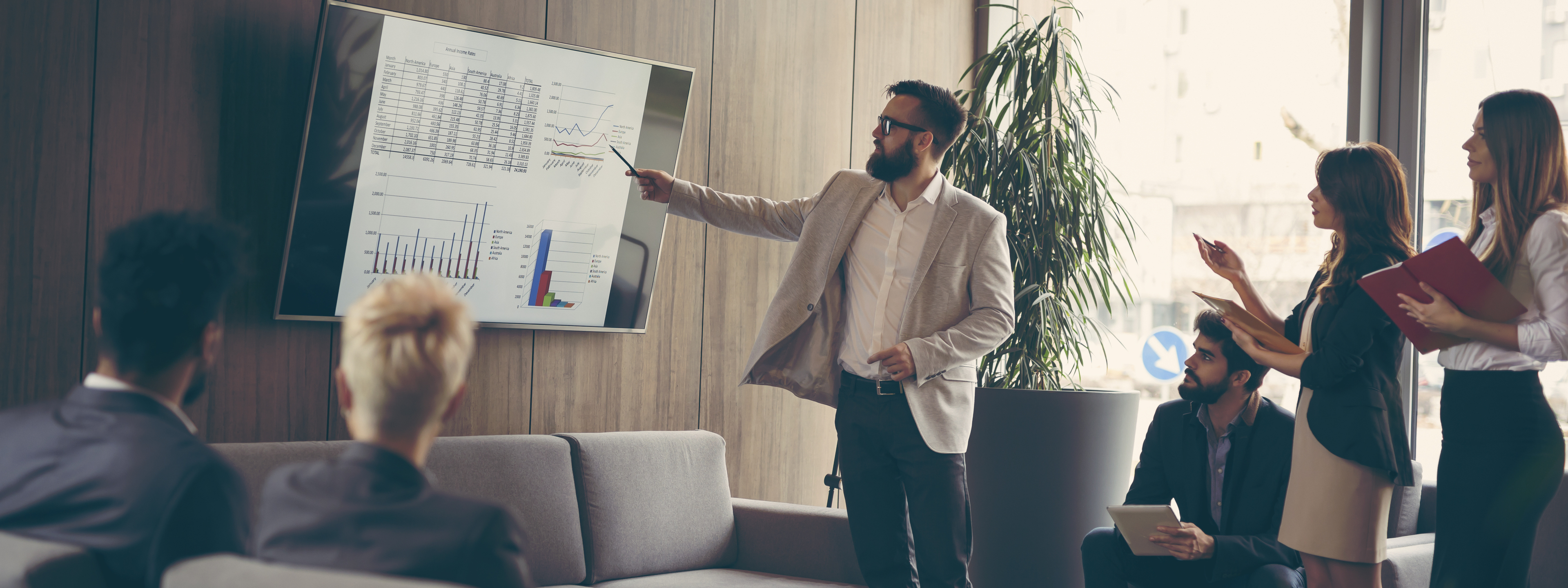 Business team on a morning briefing; business meeting and presentation in a modern office