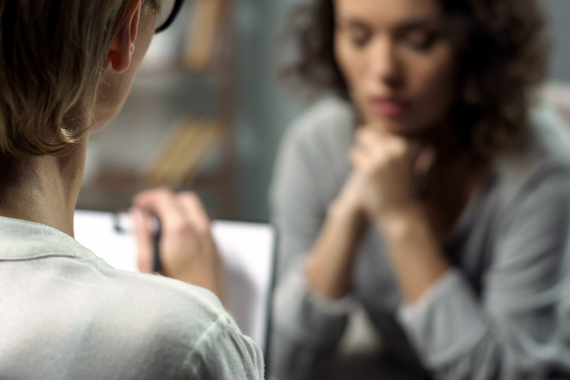 Woman attending mental health therapy session with healthcare professional