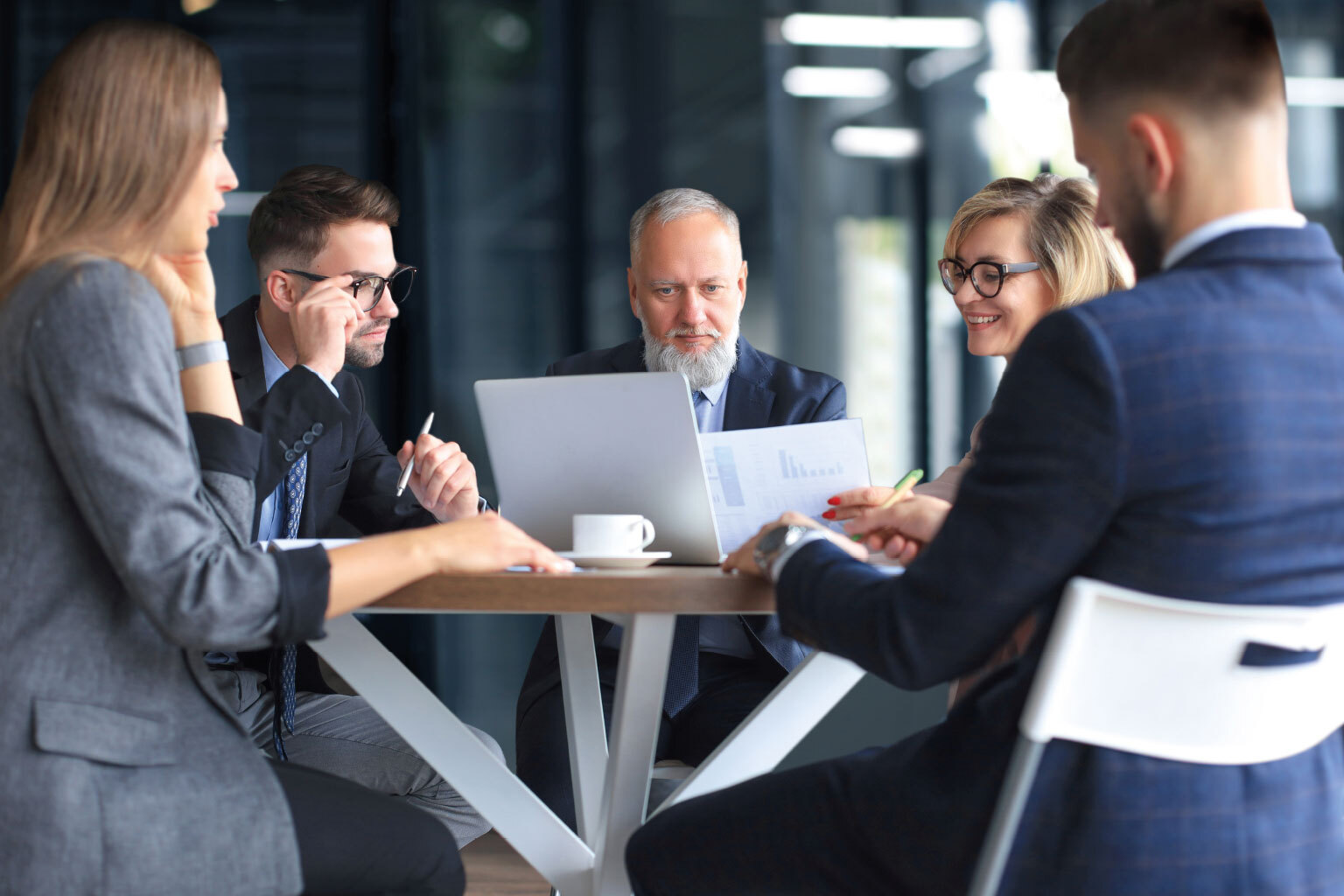 Group of business partners discussing ideas and planning work in office