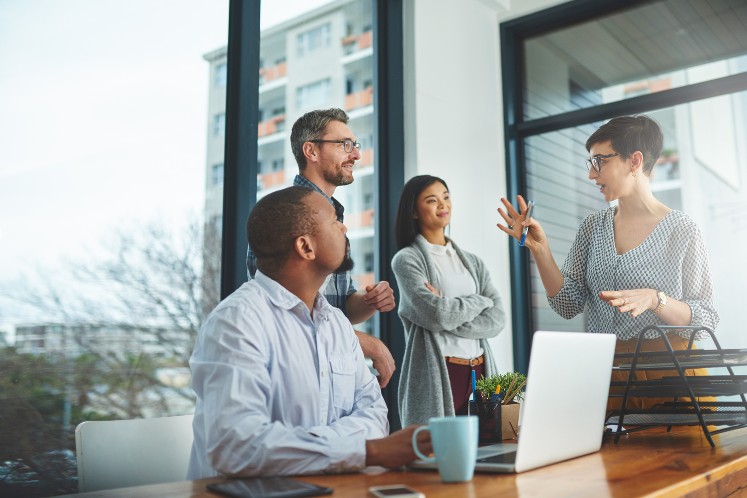 Multiracial employees discussing in a boardroom