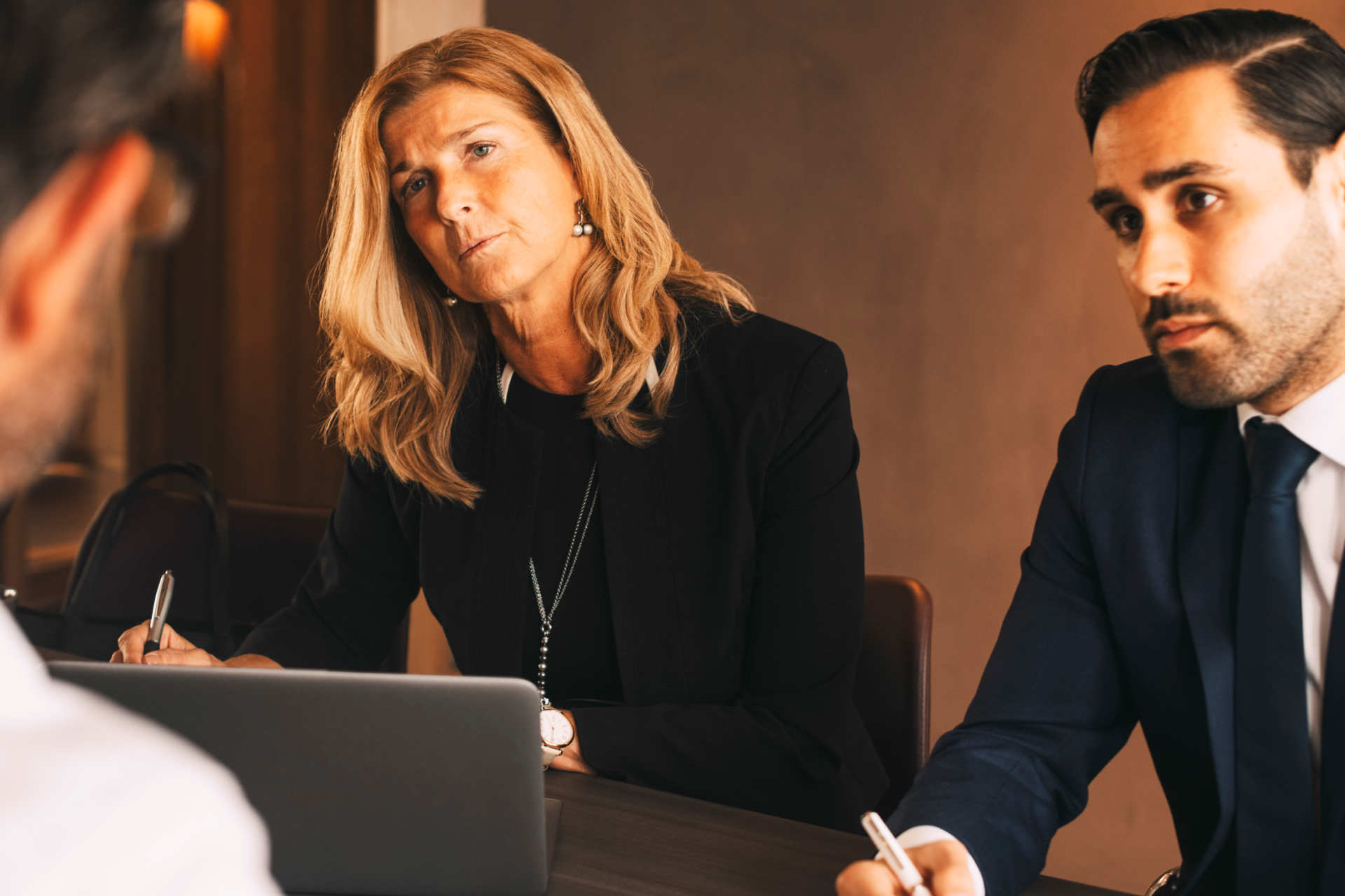 professionals sit across table