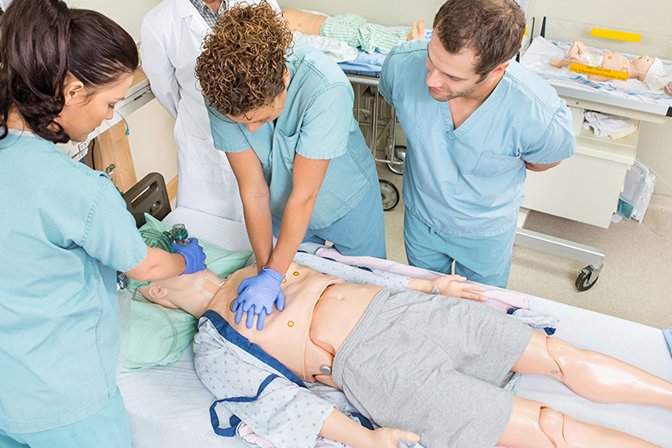 Nurses performing CPR on dummy patient