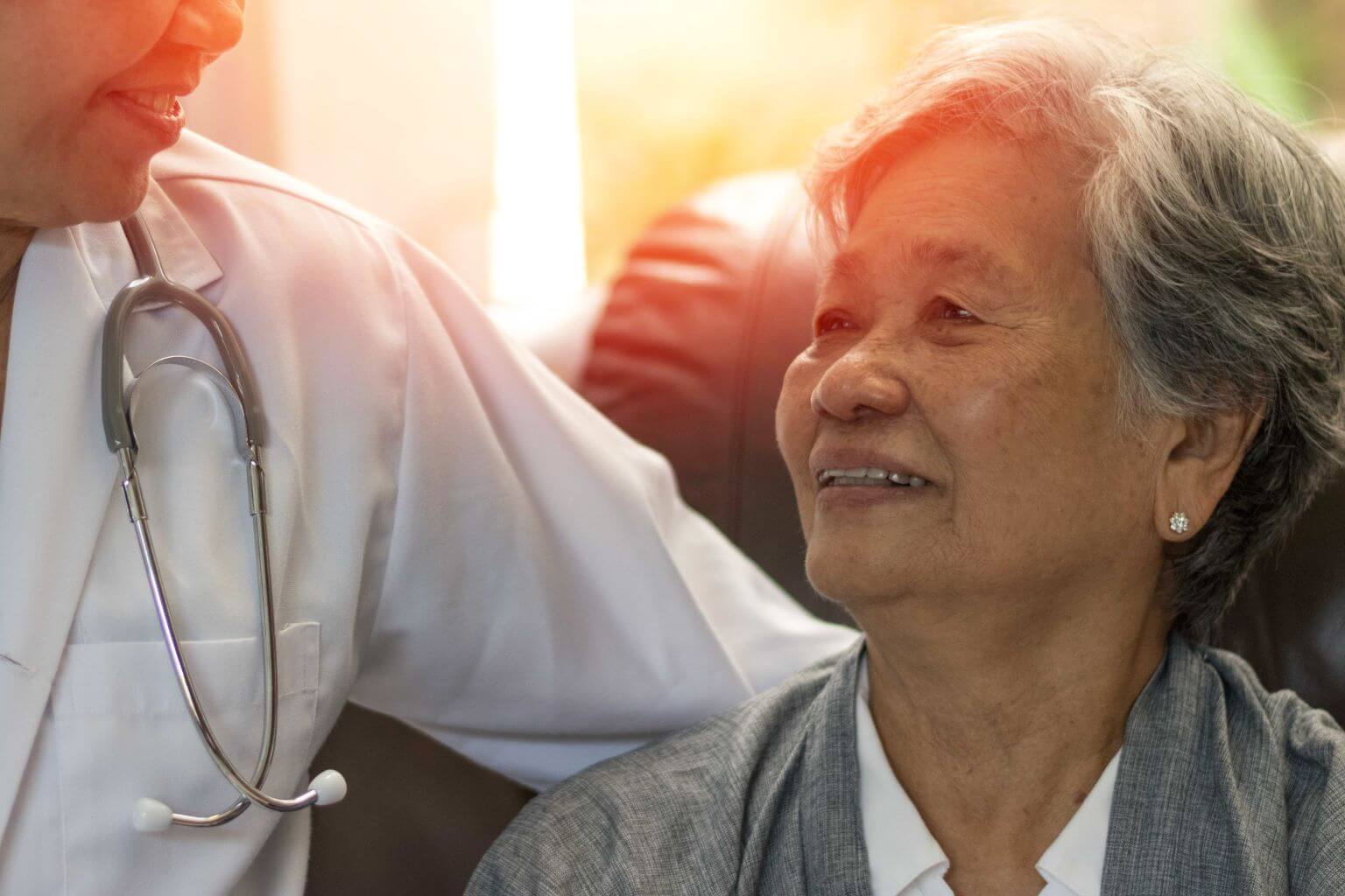 elderly-woman-holding-hands-of-caregiver