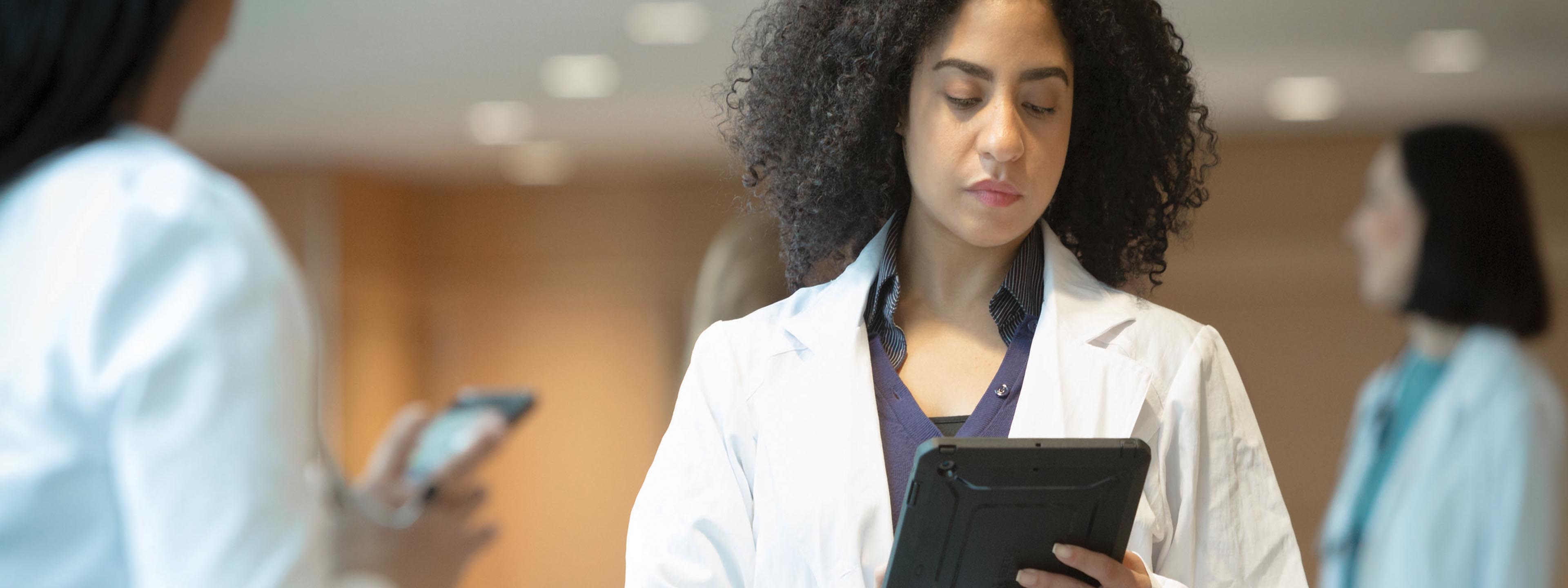 Young doctor with tablet