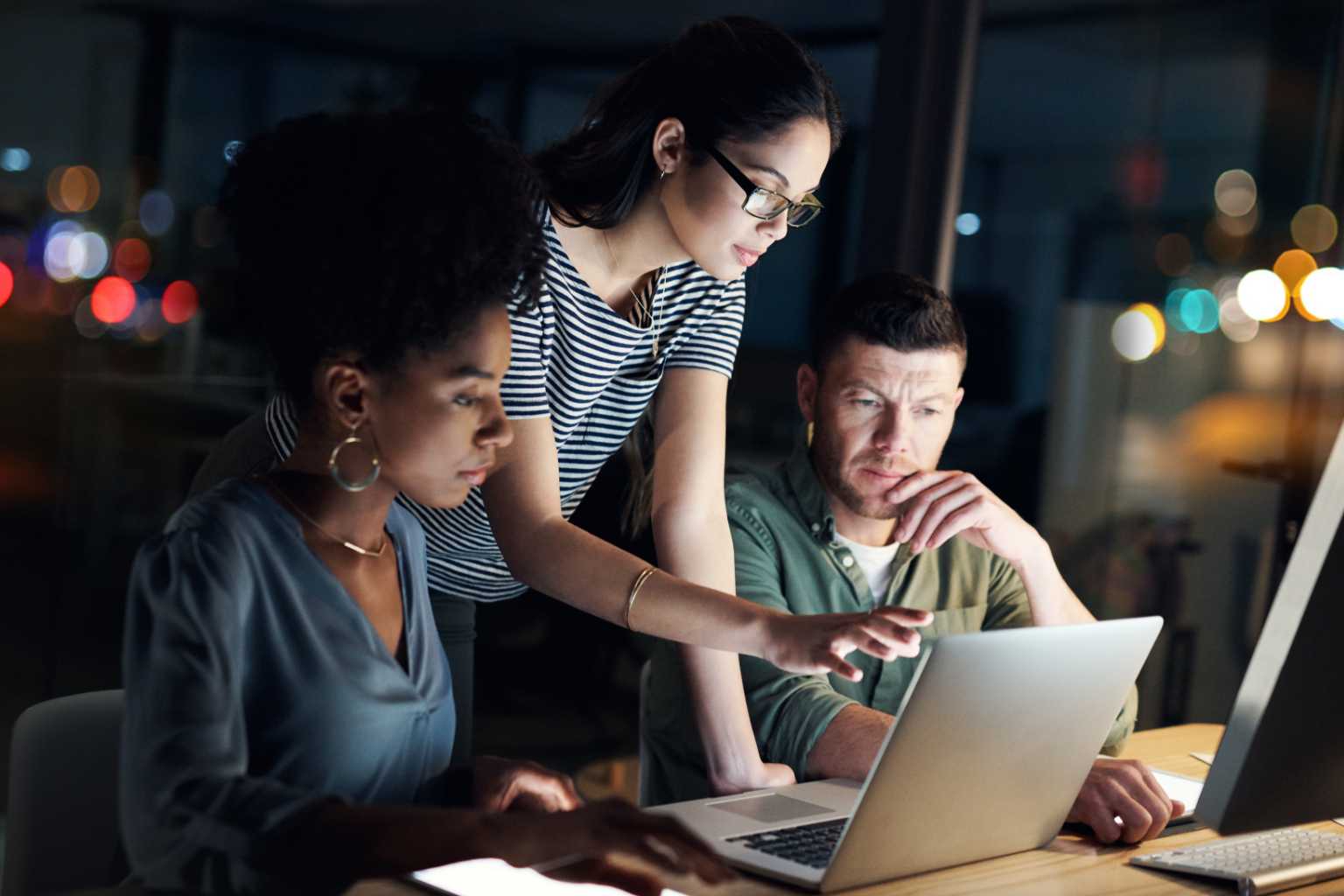 Group looks at laptop