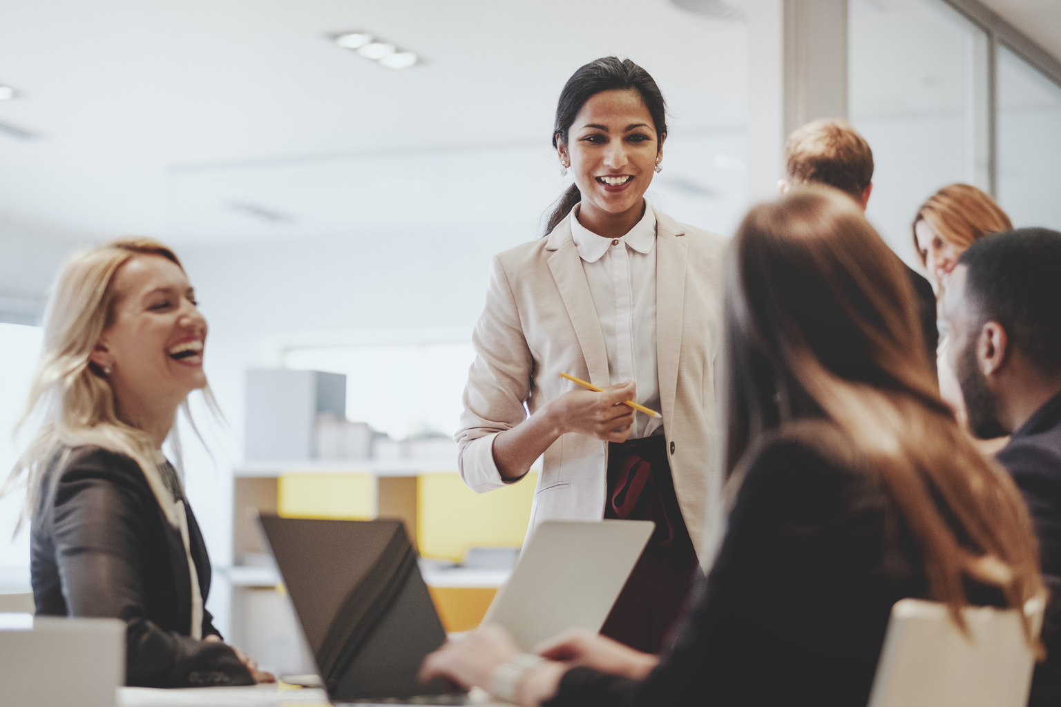 Happy female colleagues working together.