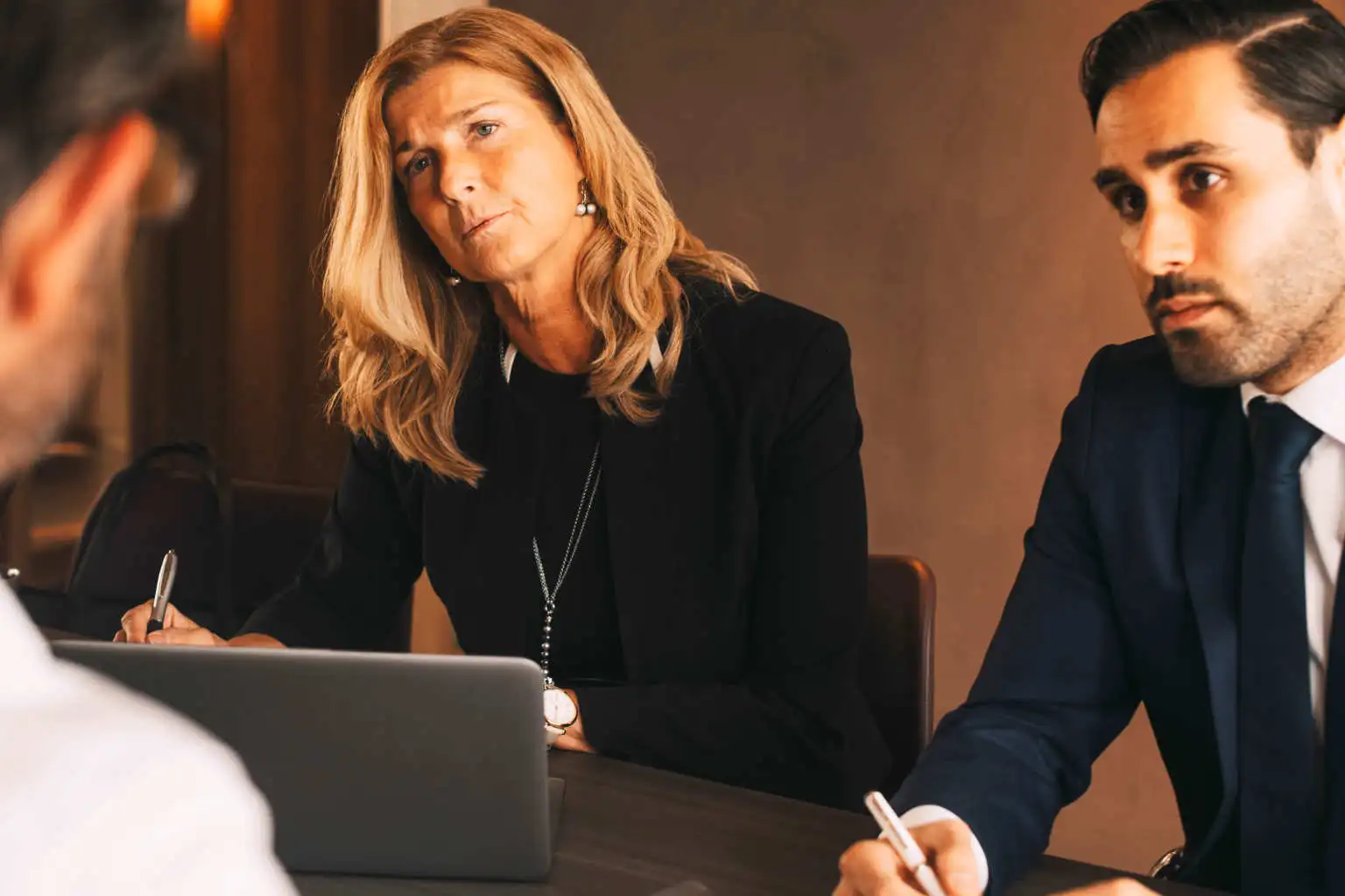 professionals sit across table