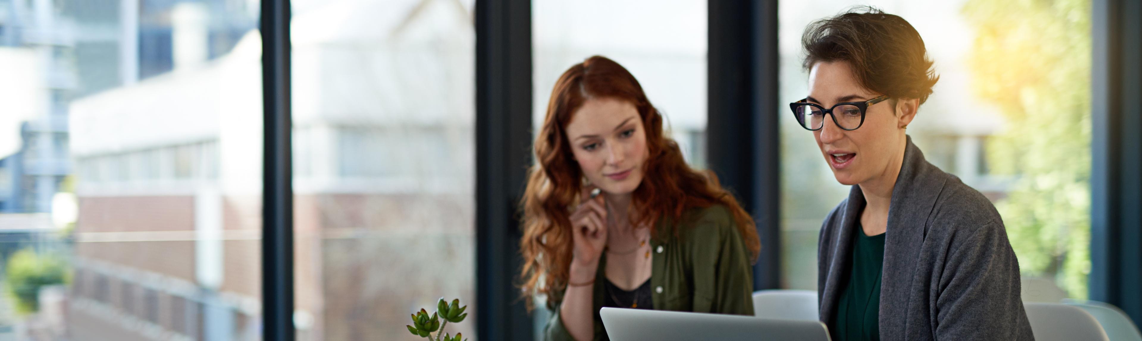 People using computer surfing the net, brainstorming, explaining and talking