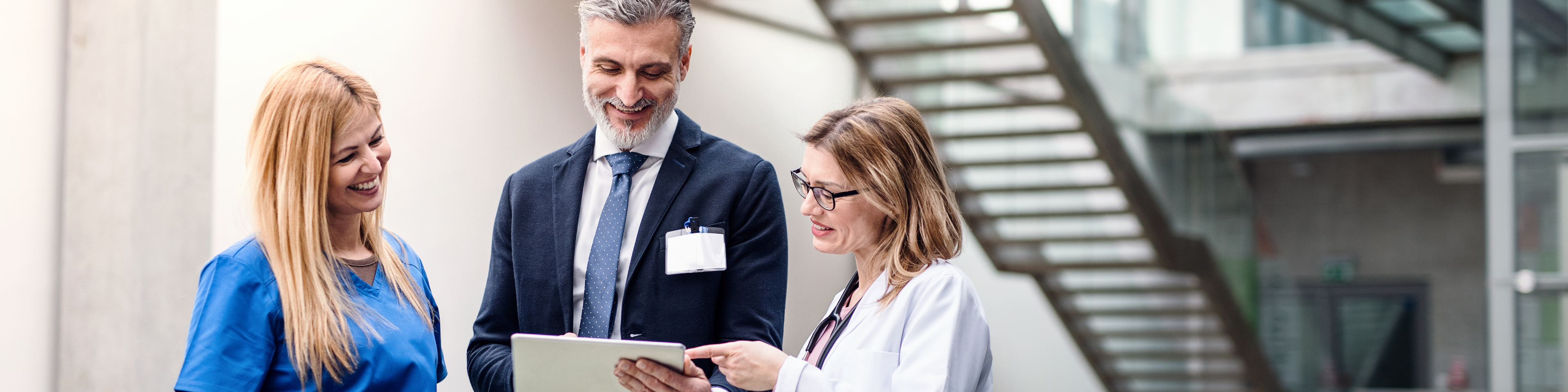 Two doctors talking to hospital administrator