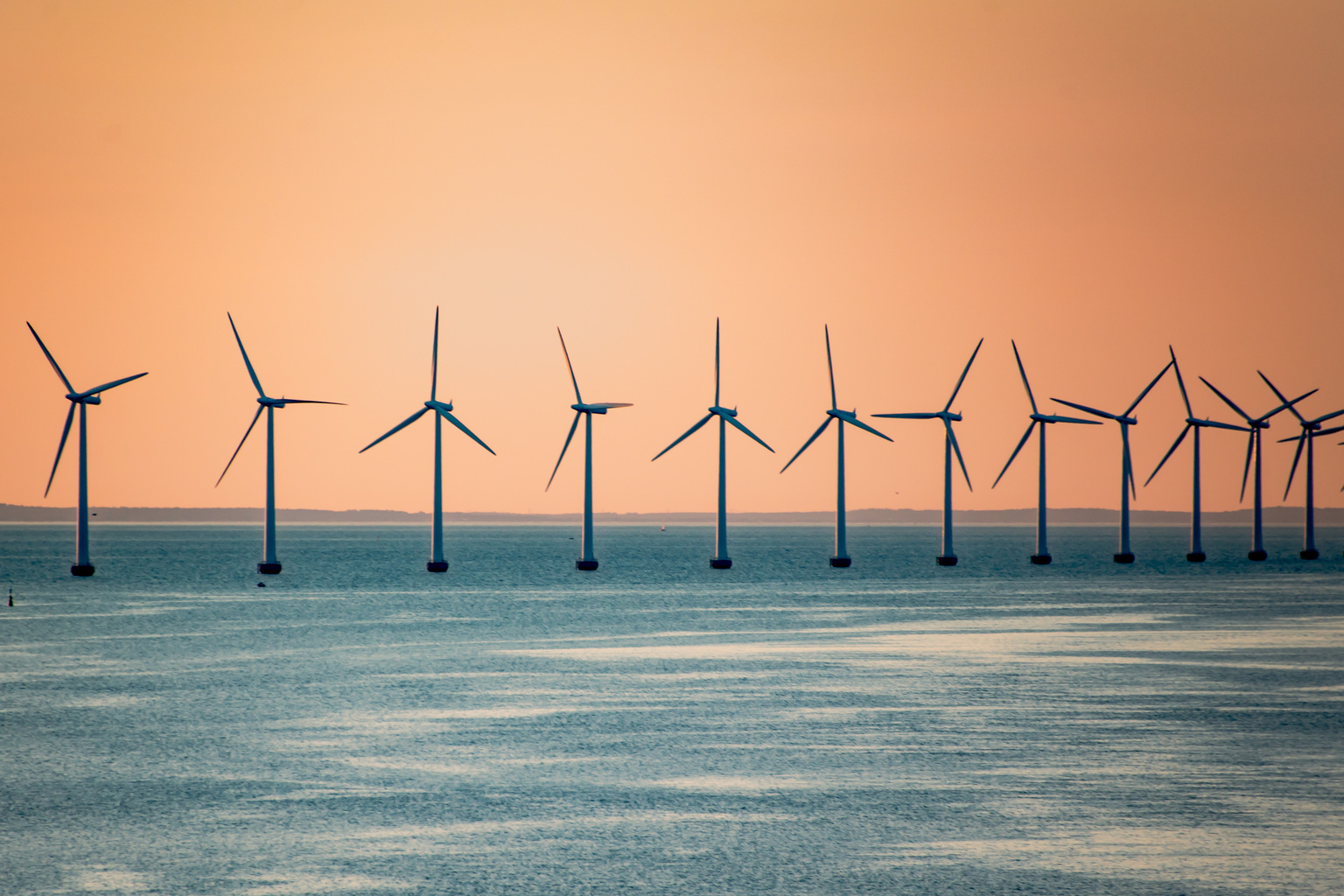 Wind turbines in windmill farm producing alternative energy in kopenhagen