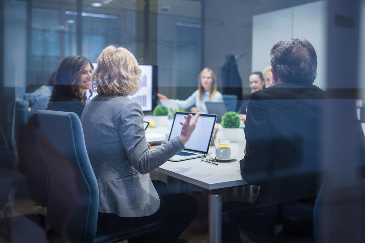 A group of businesspeople having a meeting, discussing new business strategies and brainstorming