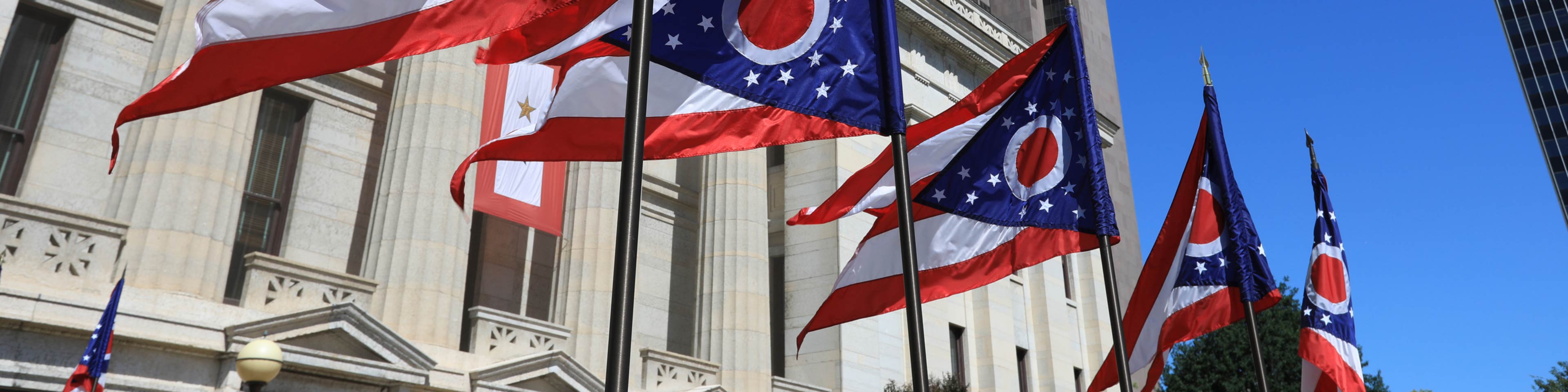 Ohio capital building with state flags out front