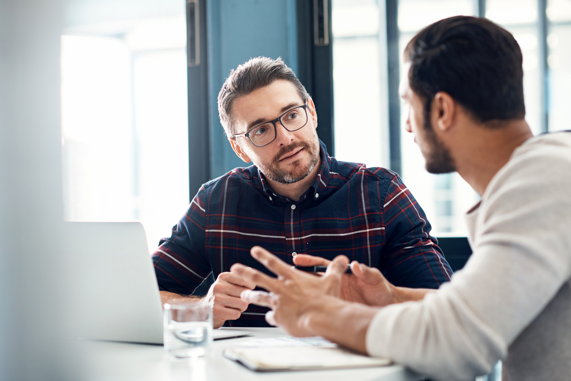 Shot of two businessmen having a discussion in an office